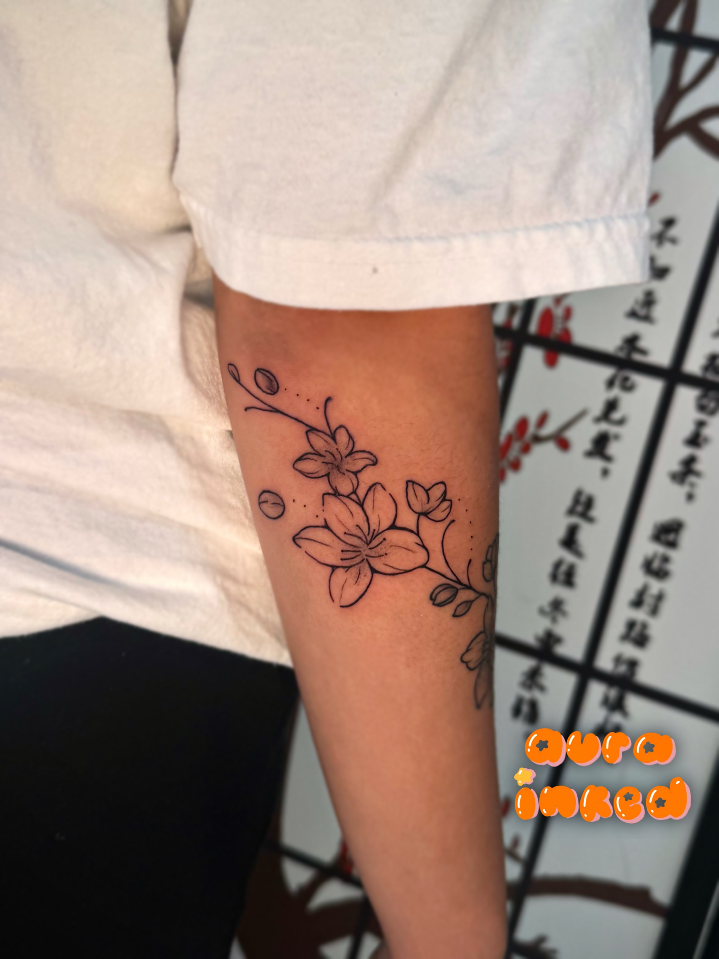 Flowers fine line tattoo on the forearm by Delly ⌯