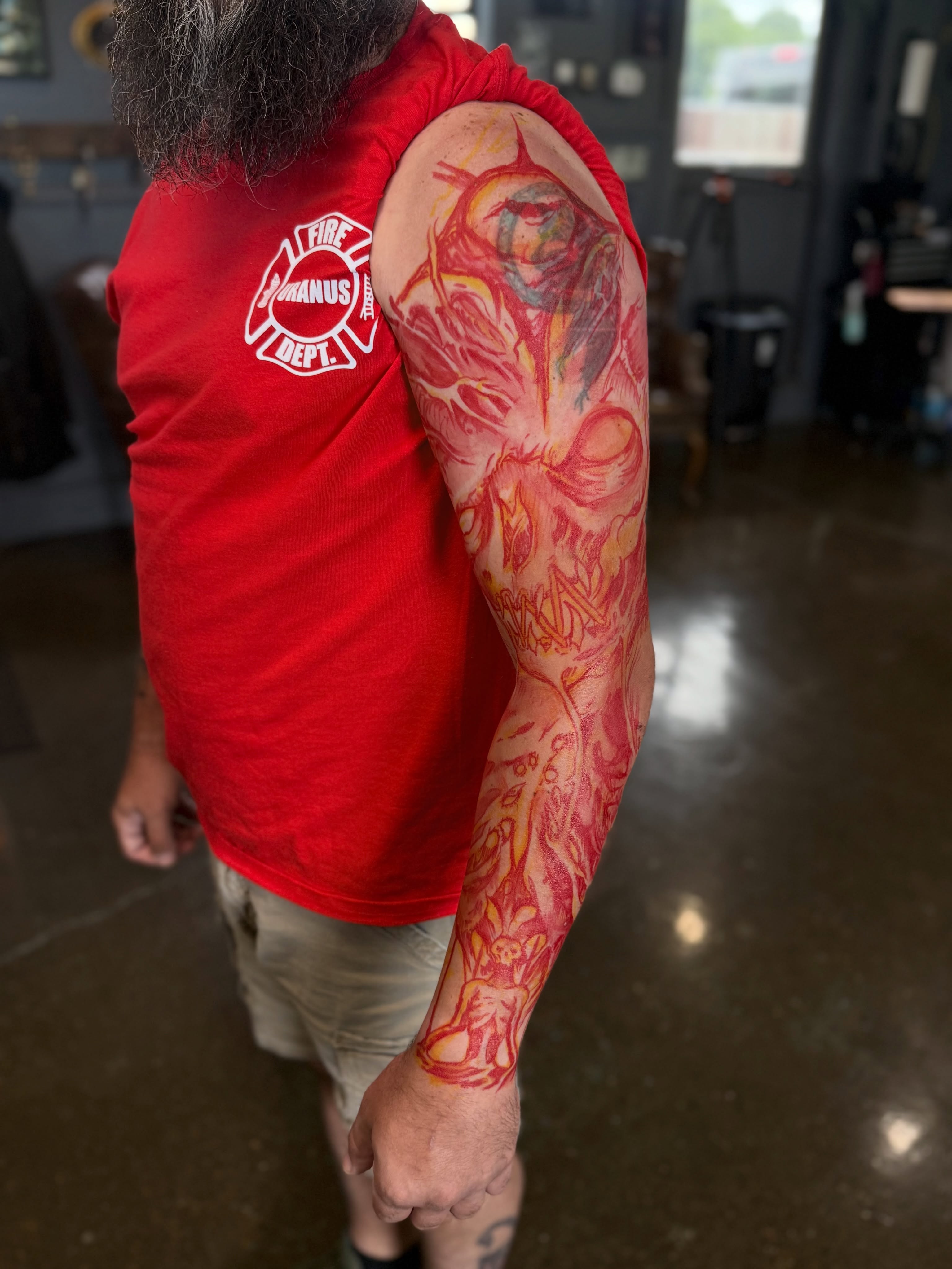 Flame and skull neo-traditional tattoo on the upper arm by Miles Haysmith