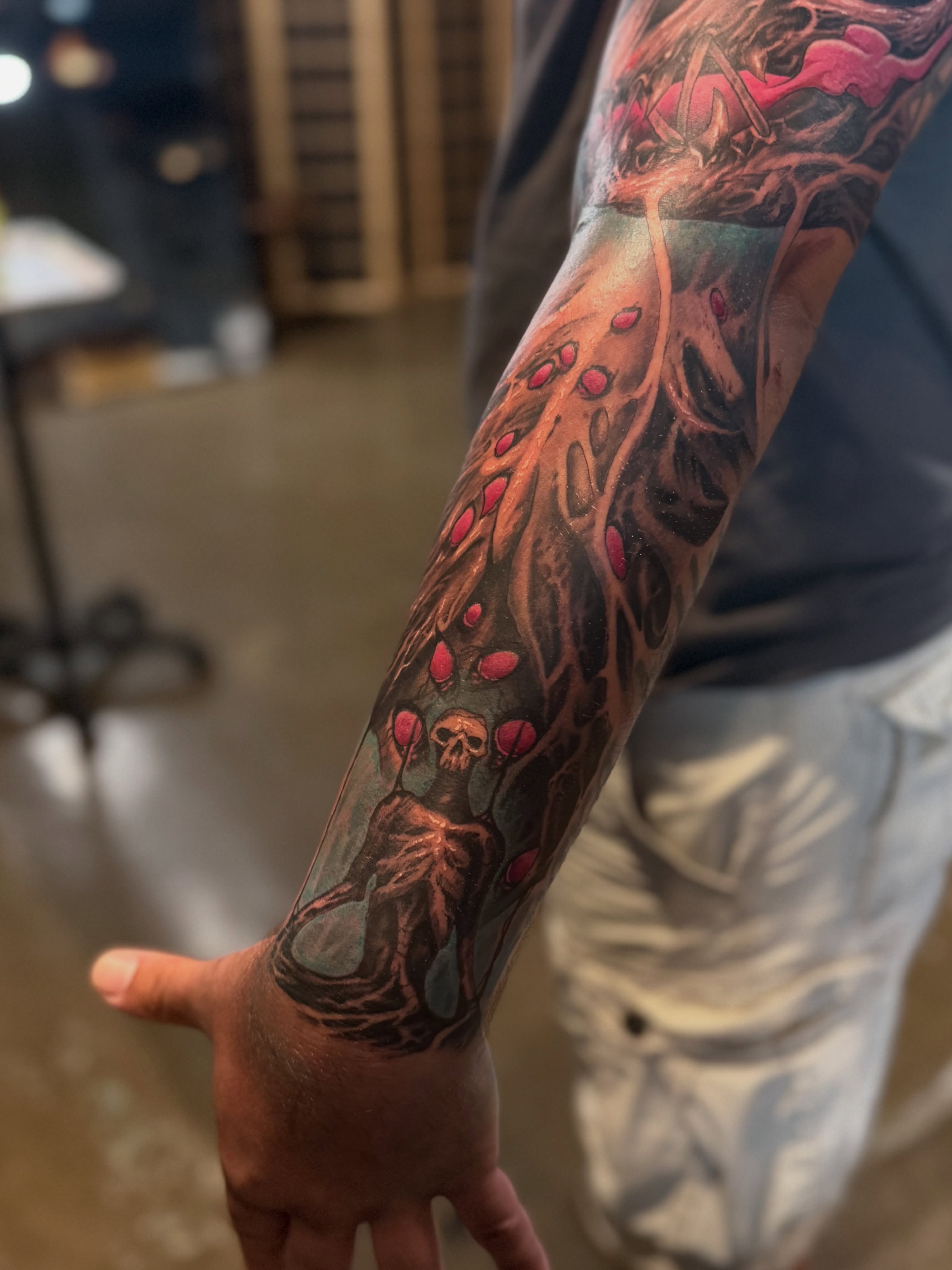 Skull and flowers dotwork tattoo on the forearm by Miles Haysmith