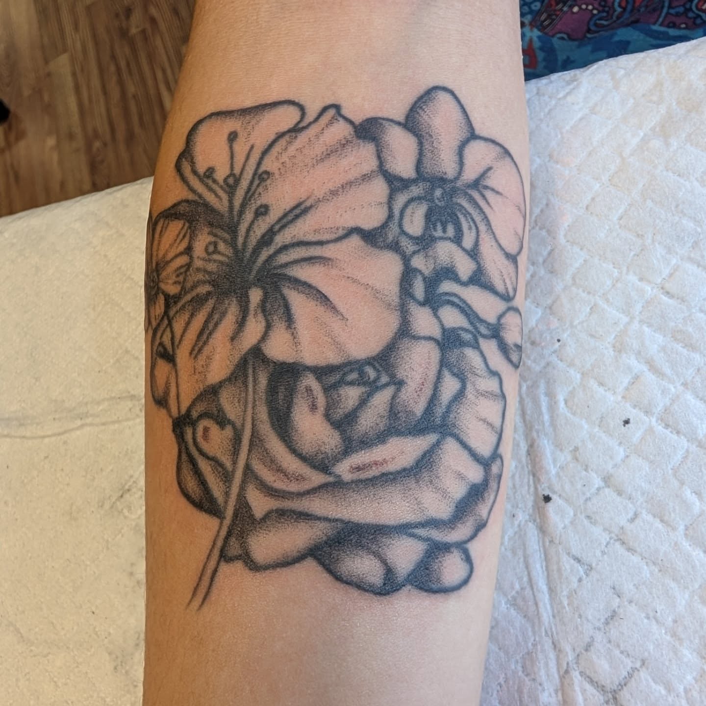 Floral bouquet dotwork tattoo on the forearm by Chad Nuber