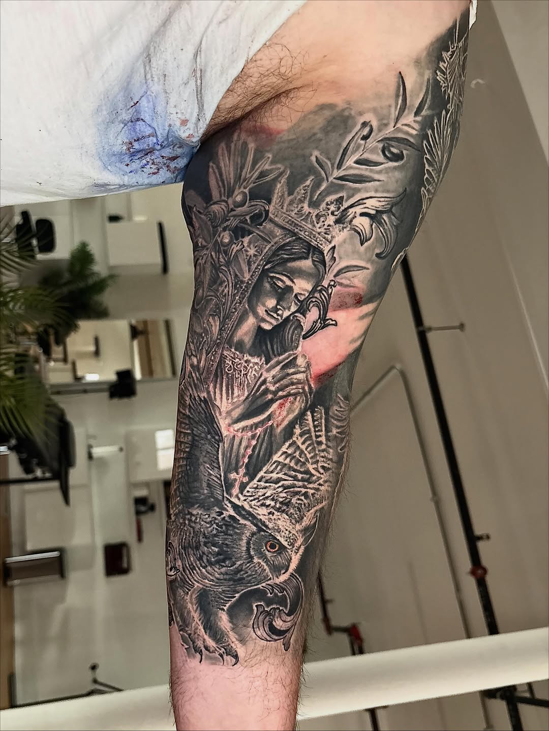 Woman with crown and owl realism tattoo on the forearm by Jacee Hamilton