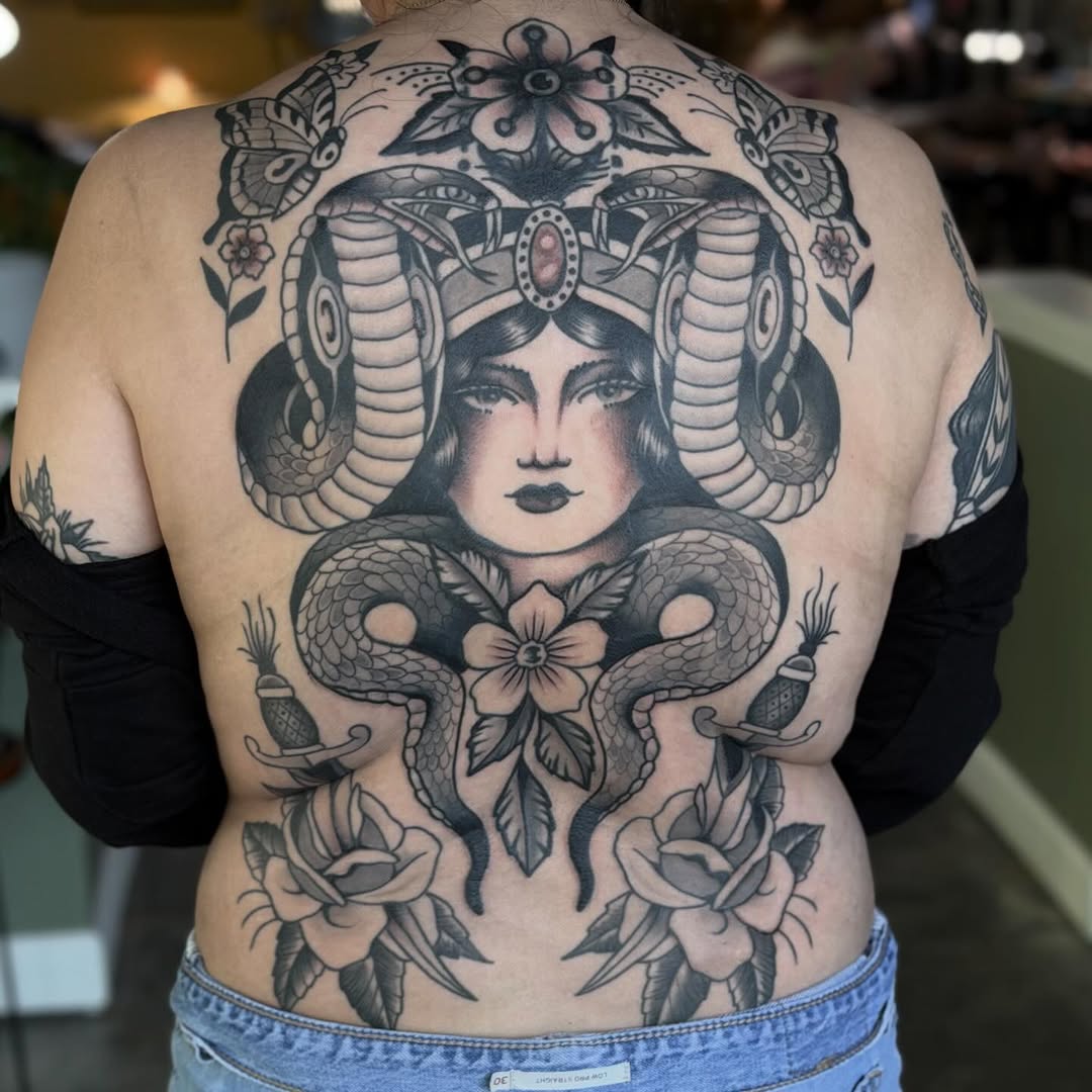 Cobra headdress with woman and roses realism tattoo on the back by Jenna Szerszen-Wynn ๐