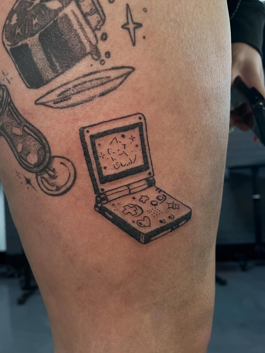 Game Boy Advance new school tattoo on the thigh by Bunny 🐰