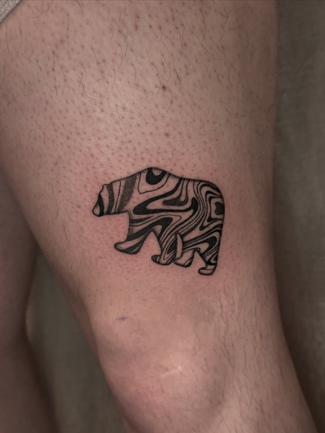 Bear with marble pattern surrealism tattoo on the forearm by Ivy🌱, New York, New York