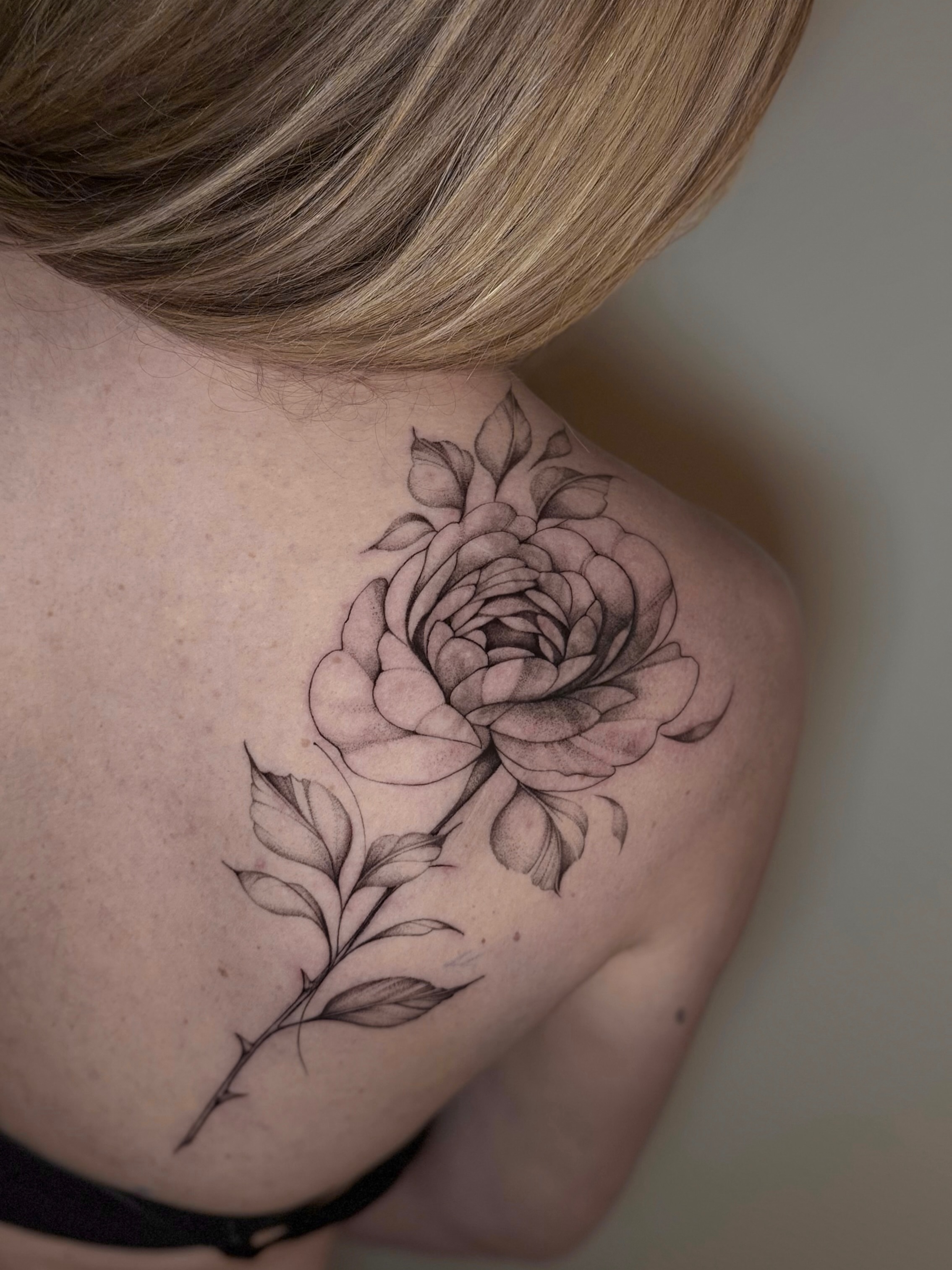 Rose black and grey tattoo on the shoulder by Kris Tattoo Chicago