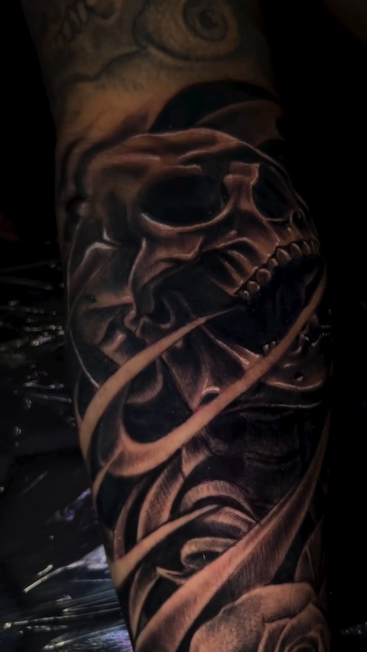 Skull and roses dark realism tattoo by Monstro Ink Arts Tattoos, Bakersfield, California