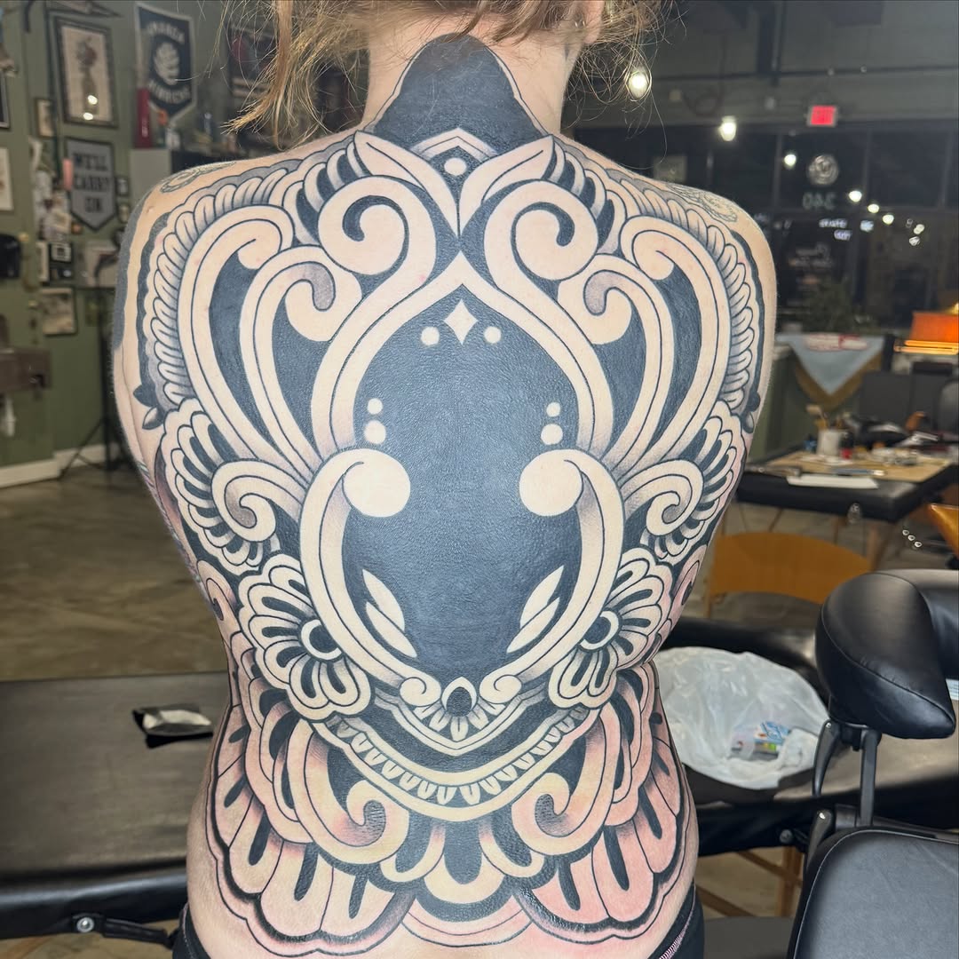 Ornamental back piece tribal tattoo on the back by @chrisskon, Carpentersville, Illinois