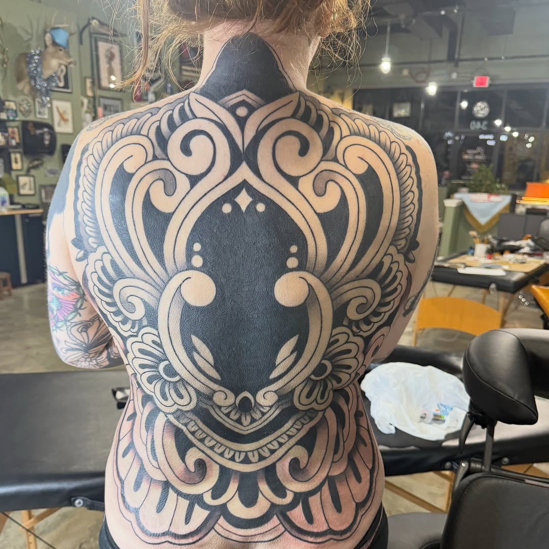 Ornamental back piece tribal tattoo on the back by @chrisskon, Carpentersville, Illinois