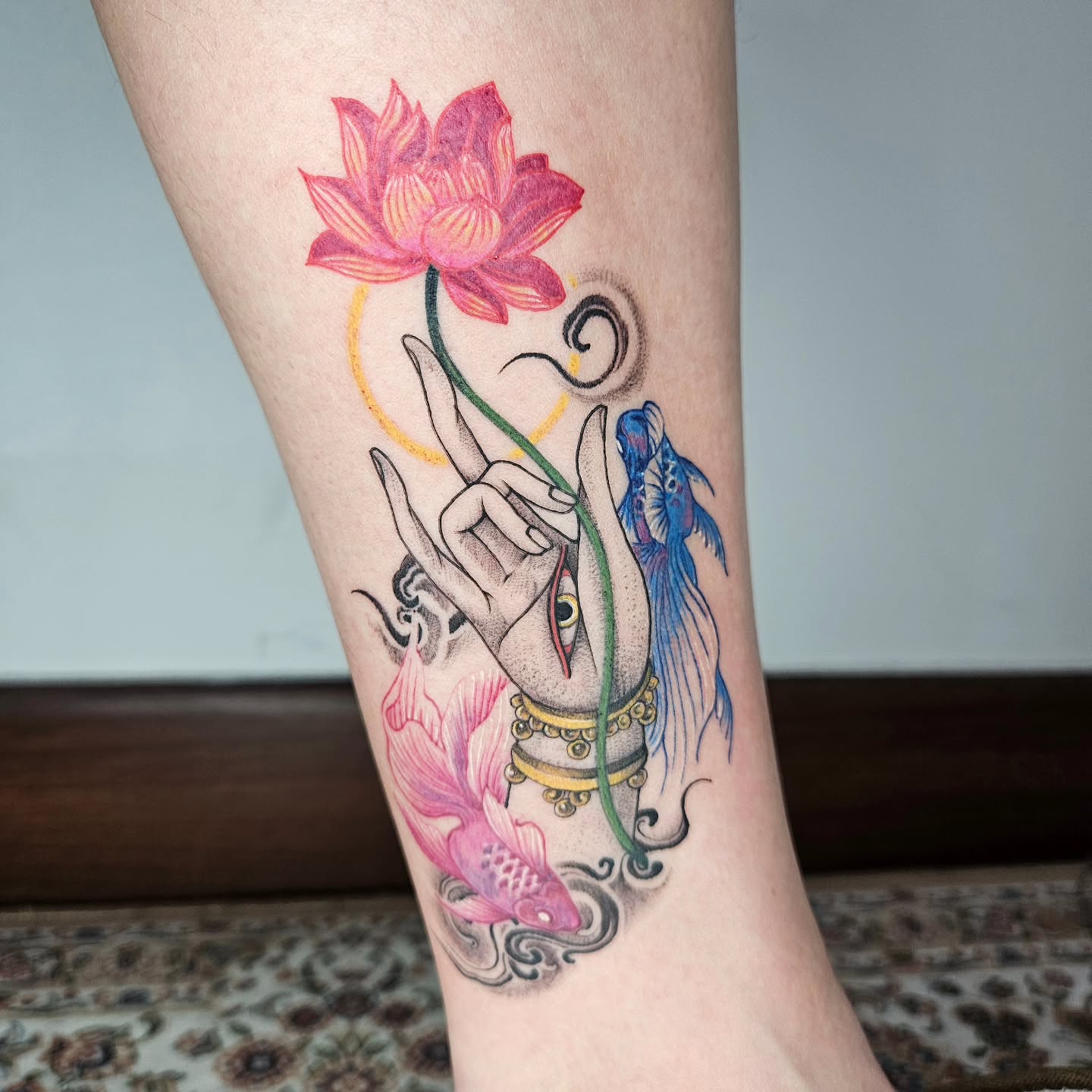 Lotus flower and hand gesture neo-traditional tattoo on the forearm by Tattooer Hermin 허민