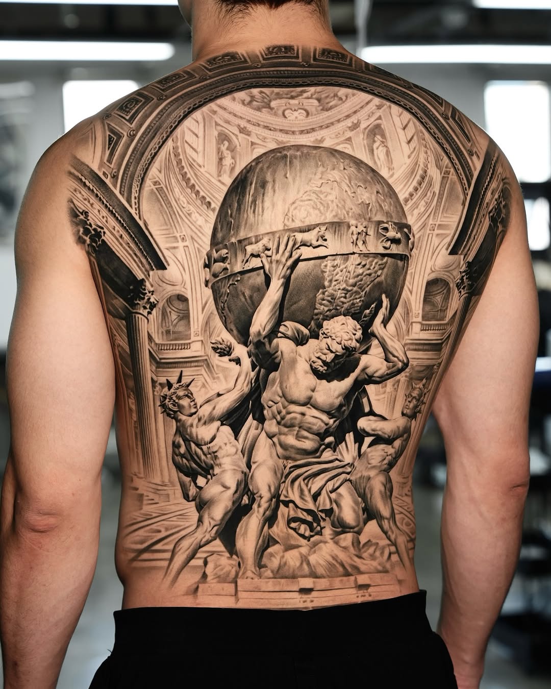 Atlas holding the celestial sphere realism tattoo on the back by Gody