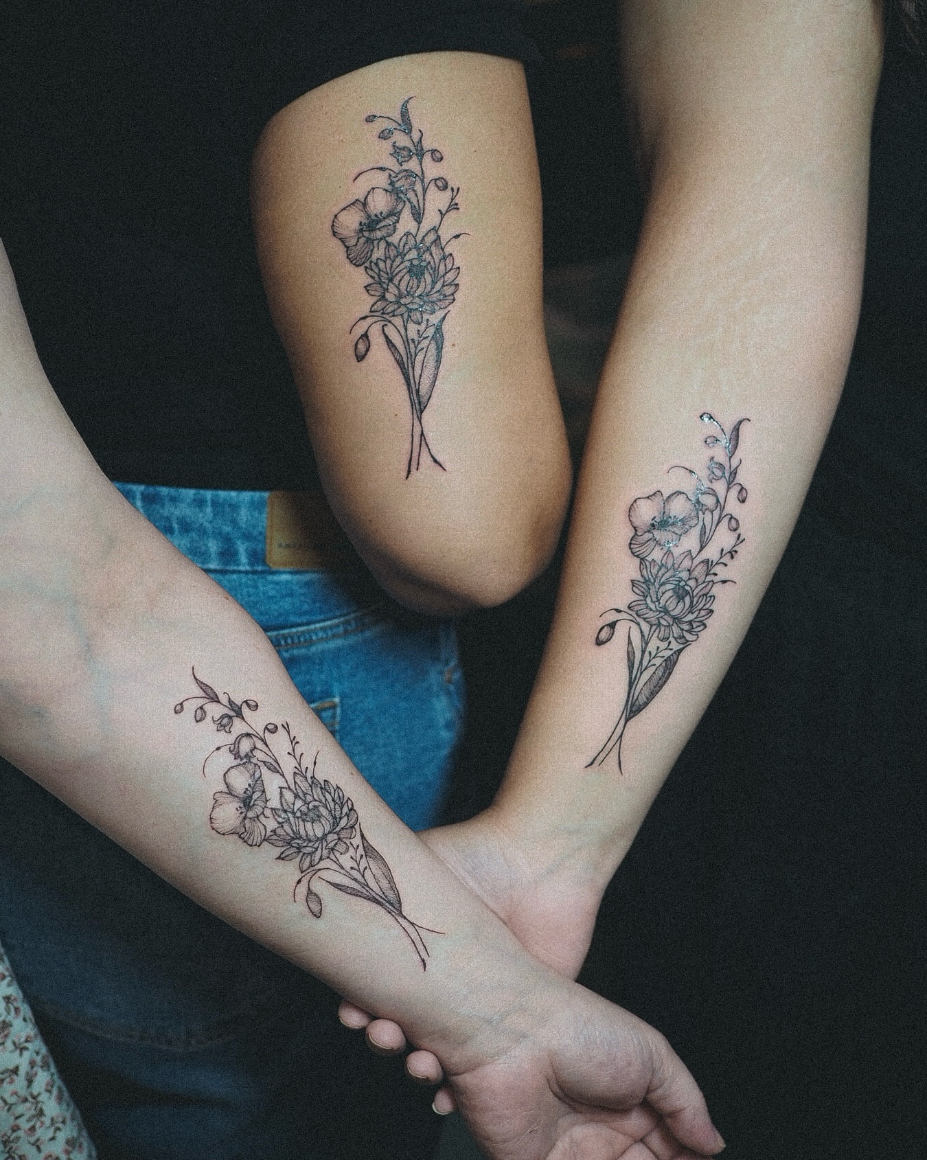 Floral bouquet black and grey tattoo on the forearm by Inks by Nastia