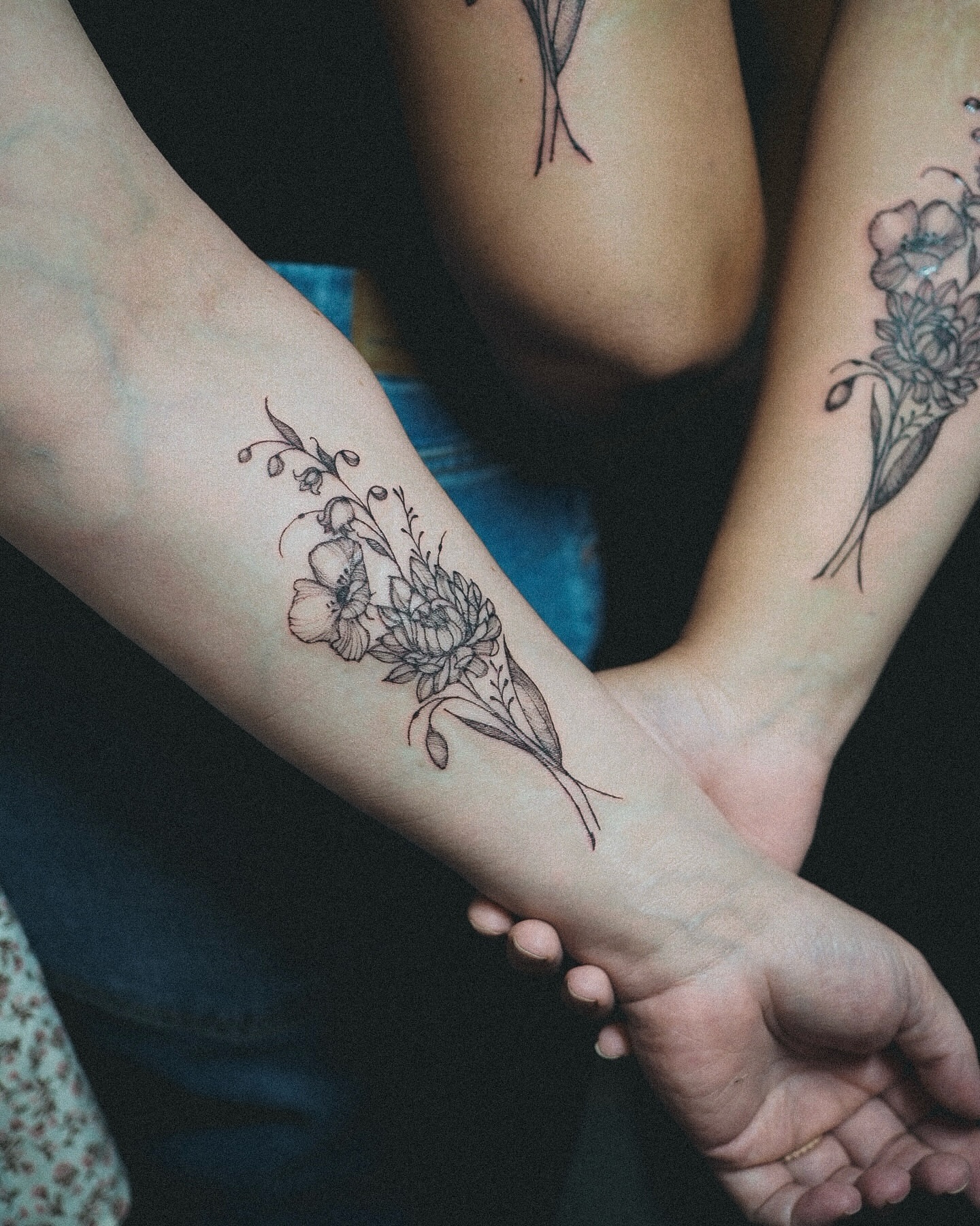 Floral bouquet black and grey tattoo on the forearm by Inks by Nastia