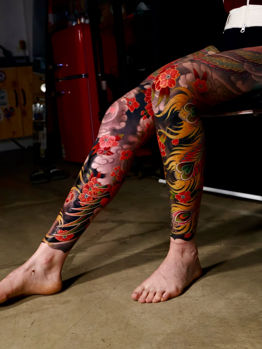 Phoenix and cherry blossoms Japanese tattoo on the leg by Hocheon