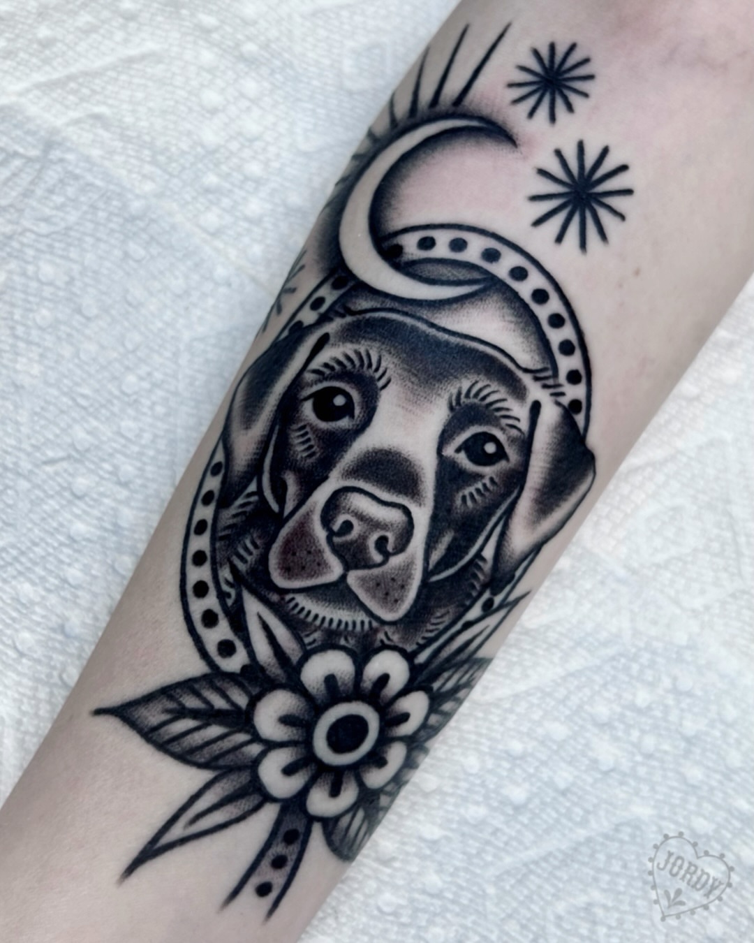 Dog head with floral ornament American traditional tattoo on the forearm by jordy, Philadelphia, Pennsylvania