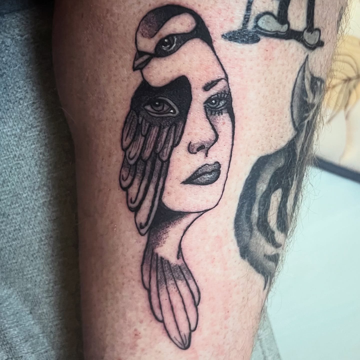 Woman with bird realism tattoo on the forearm by Evan Intveld