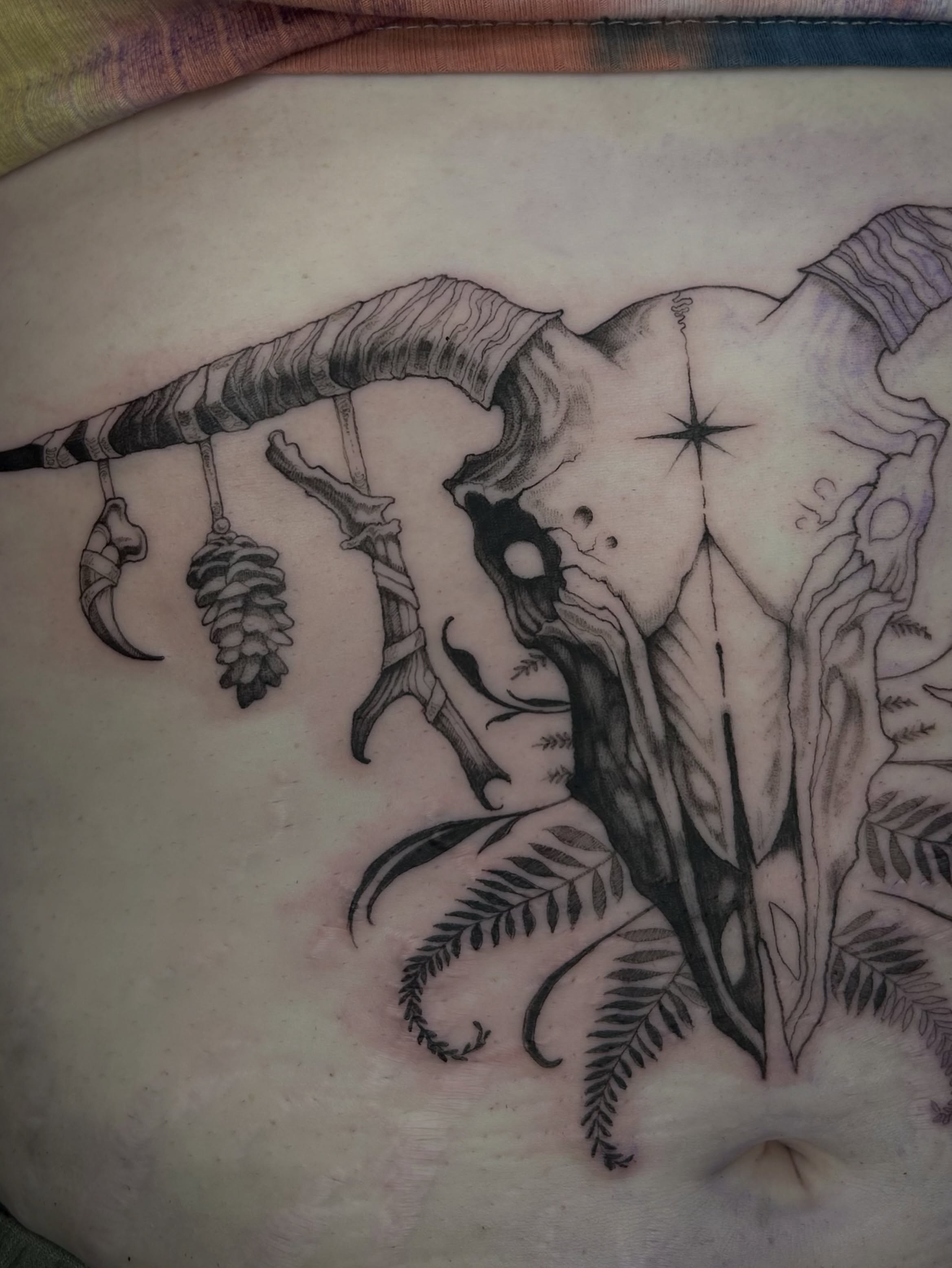 Deer skull and antlers realism tattoo on the torso by Magnus