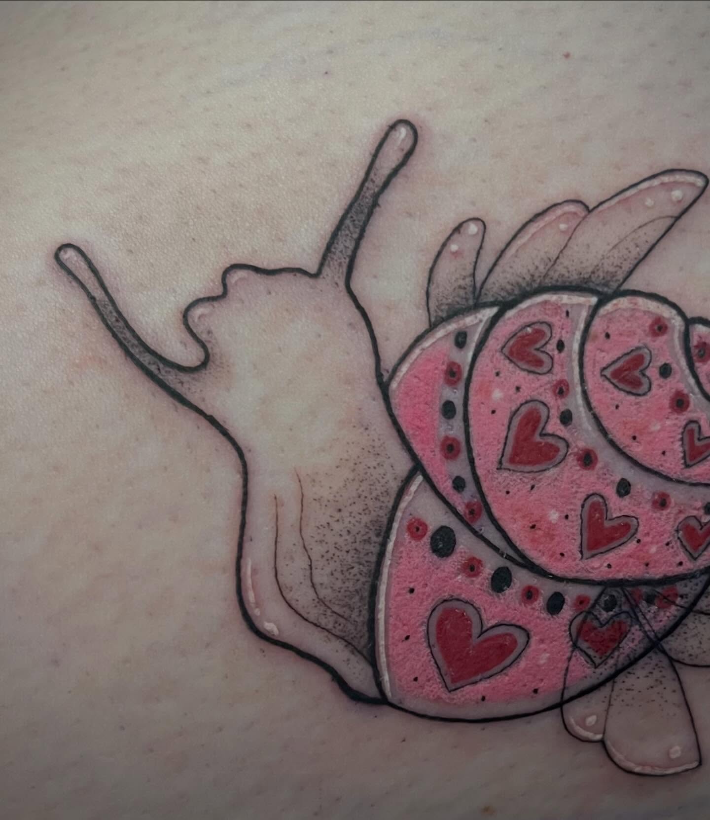 Snail dotwork tattoo on the torso by Freya Petersen
