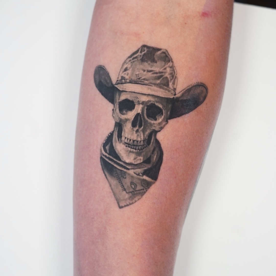 Cowboy skull realism tattoo on the forearm by Tate Wortham