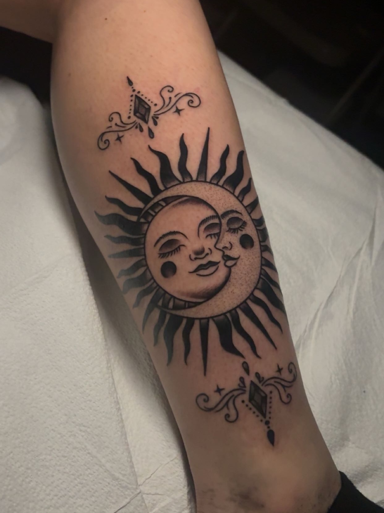 Sun black and grey tattoo on the forearm by Chris Prince Jr., Miamisburg, Ohio