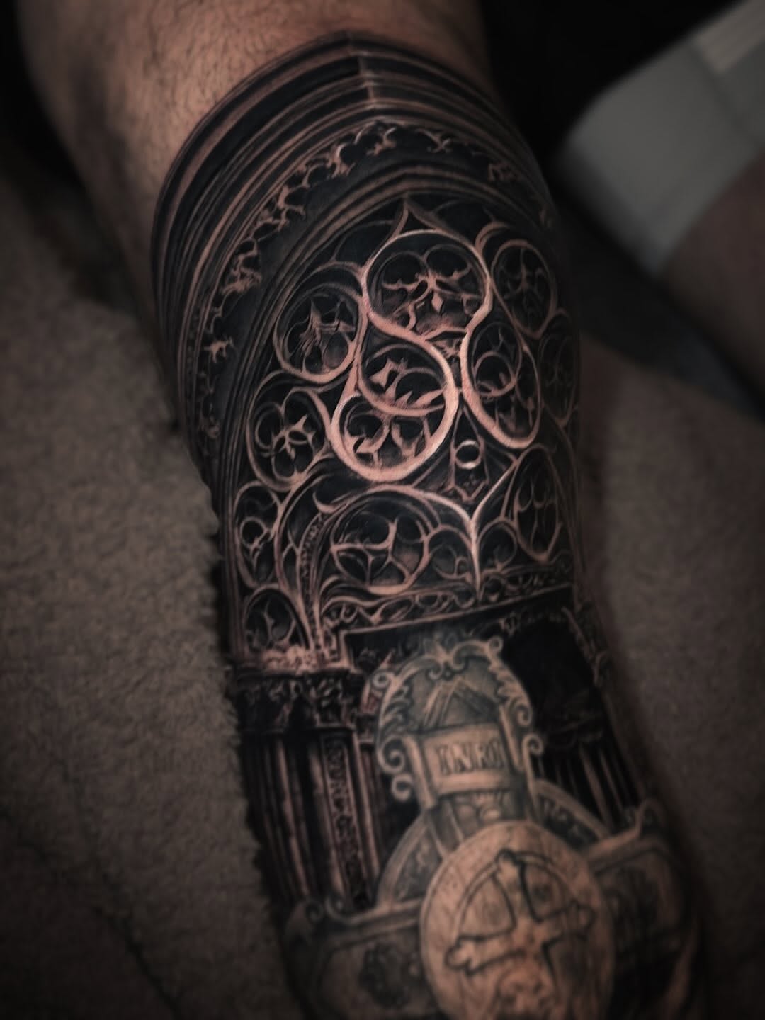 Gothic architecture geometric tattoo on the forearm by Pitasso tattoo black and grey