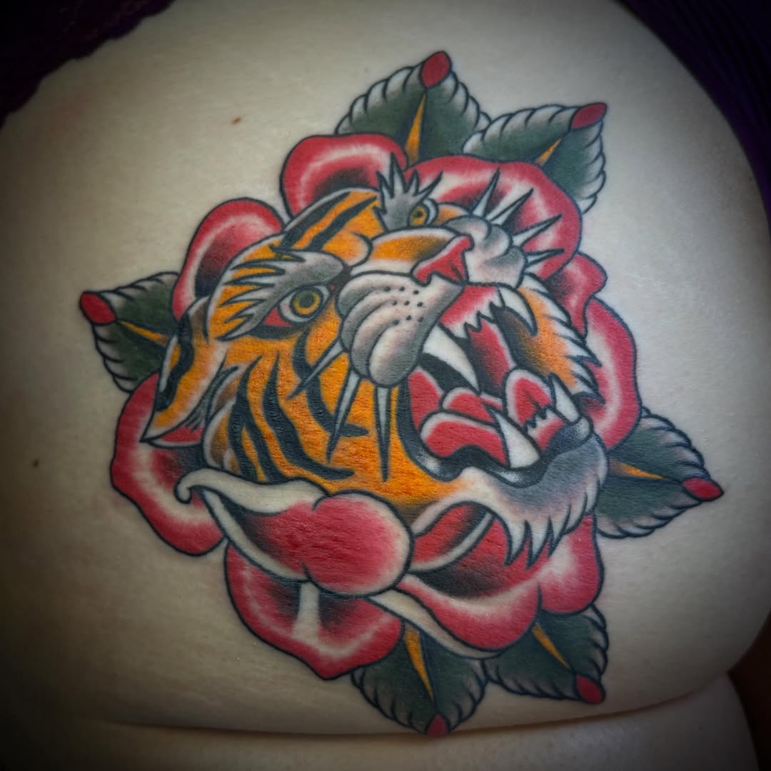 Tiger and rose American traditional tattoo on the torso by ArJay Smith