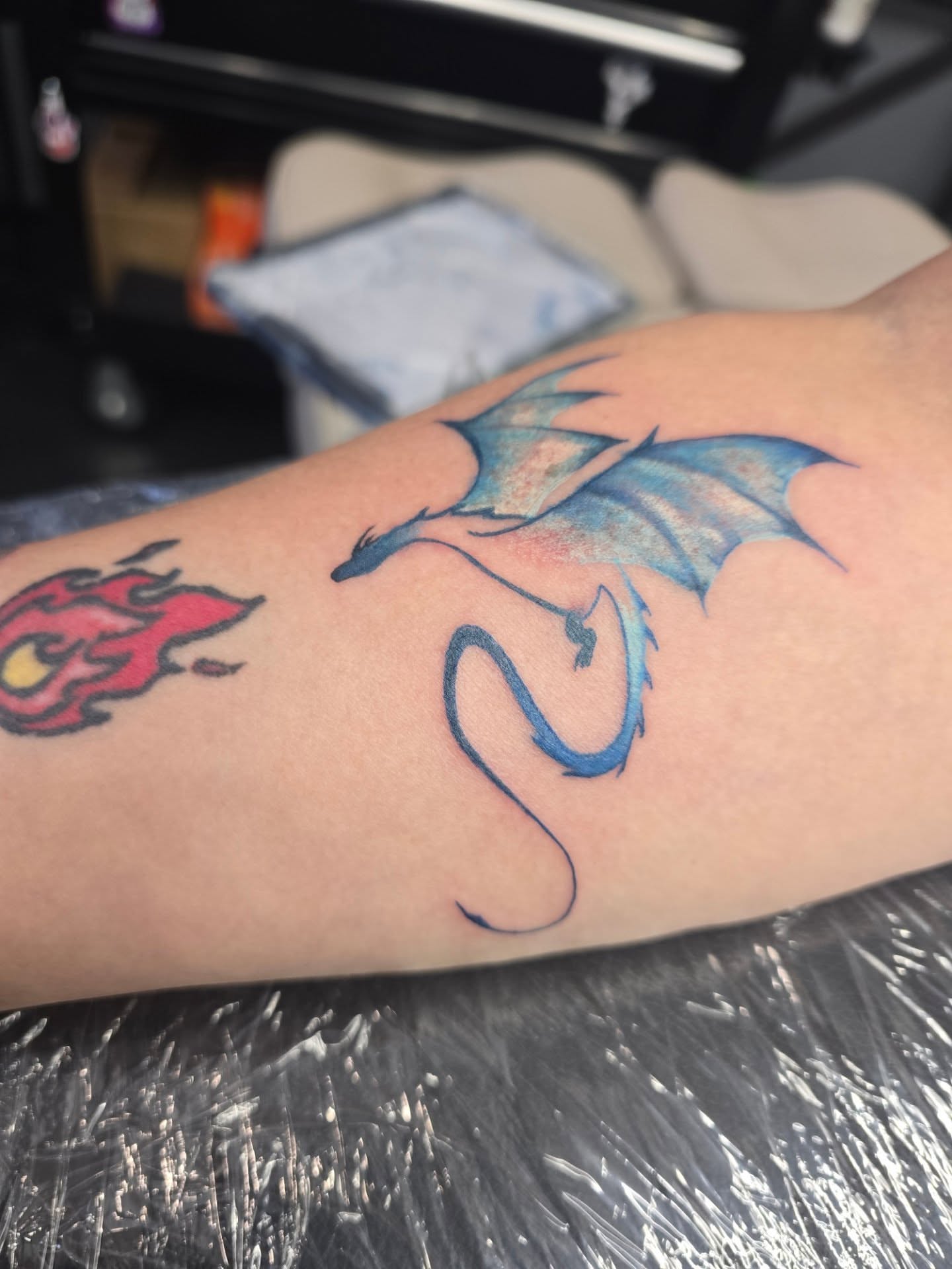 Blue dragon dotwork tattoo on the forearm by Maddox Kitson🕷