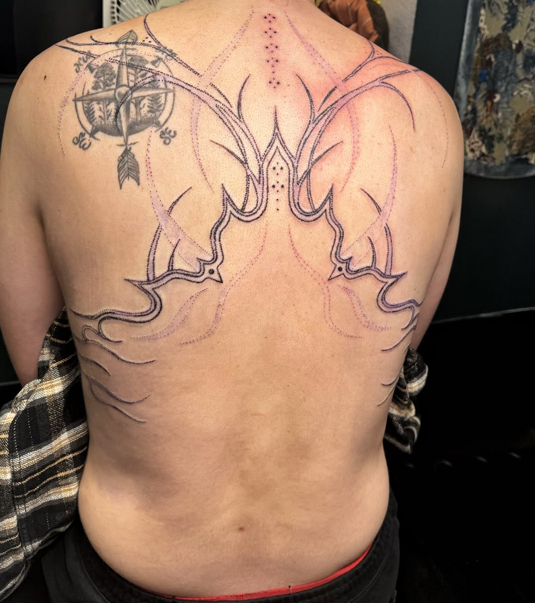 Antlers dotwork tattoo on the back by Handpoke Tattoo Artist, Minneapolis, Minnesota