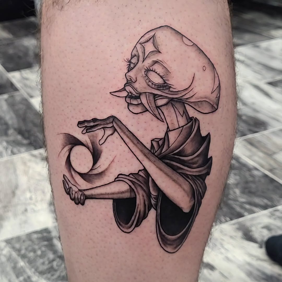 Creature with tongue and black hole surrealism tattoo on the forearm by TEA ☕️ Tattoos