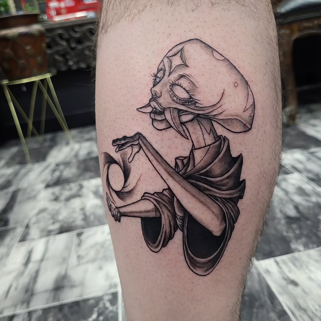 Creature with mushroom head surrealism tattoo on the thigh by TEA ☕️ Tattoos