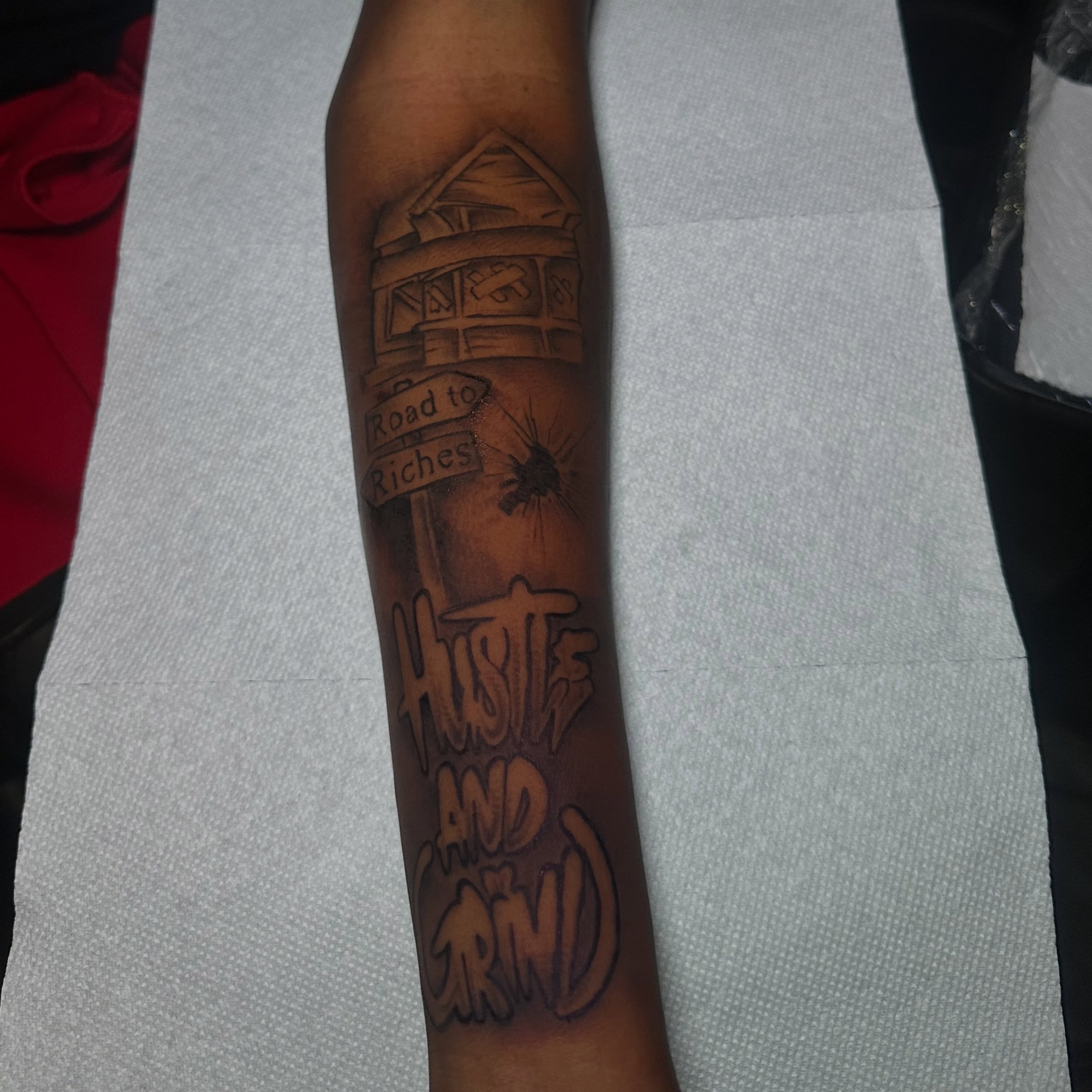 Road sign black and grey tattoo on the forearm by @tattedbytuck