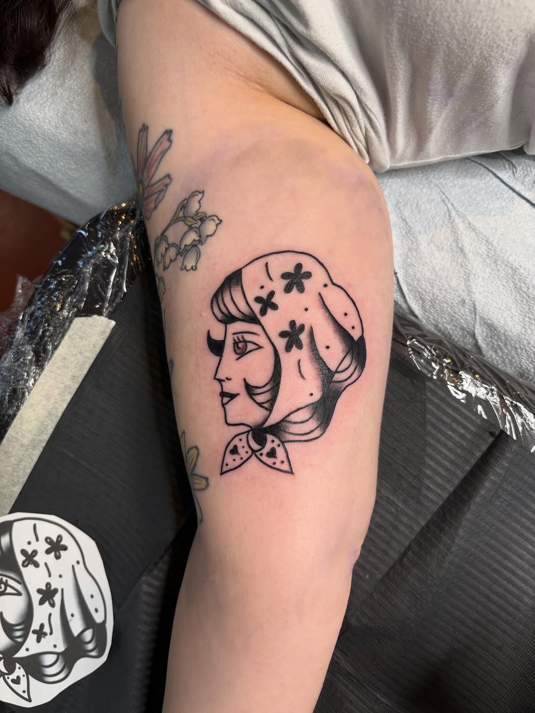 Woman's head with headscarf neo-traditional tattoo on the forearm by ellie