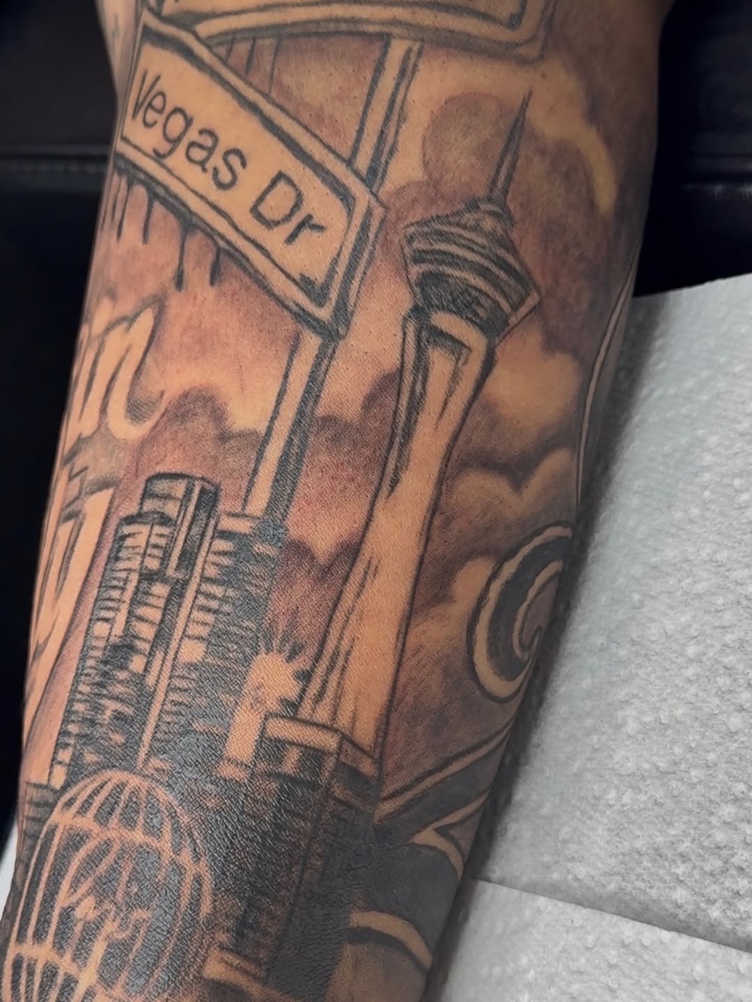 Las Vegas skyline and street sign Chicano tattoo on the forearm by Betotats