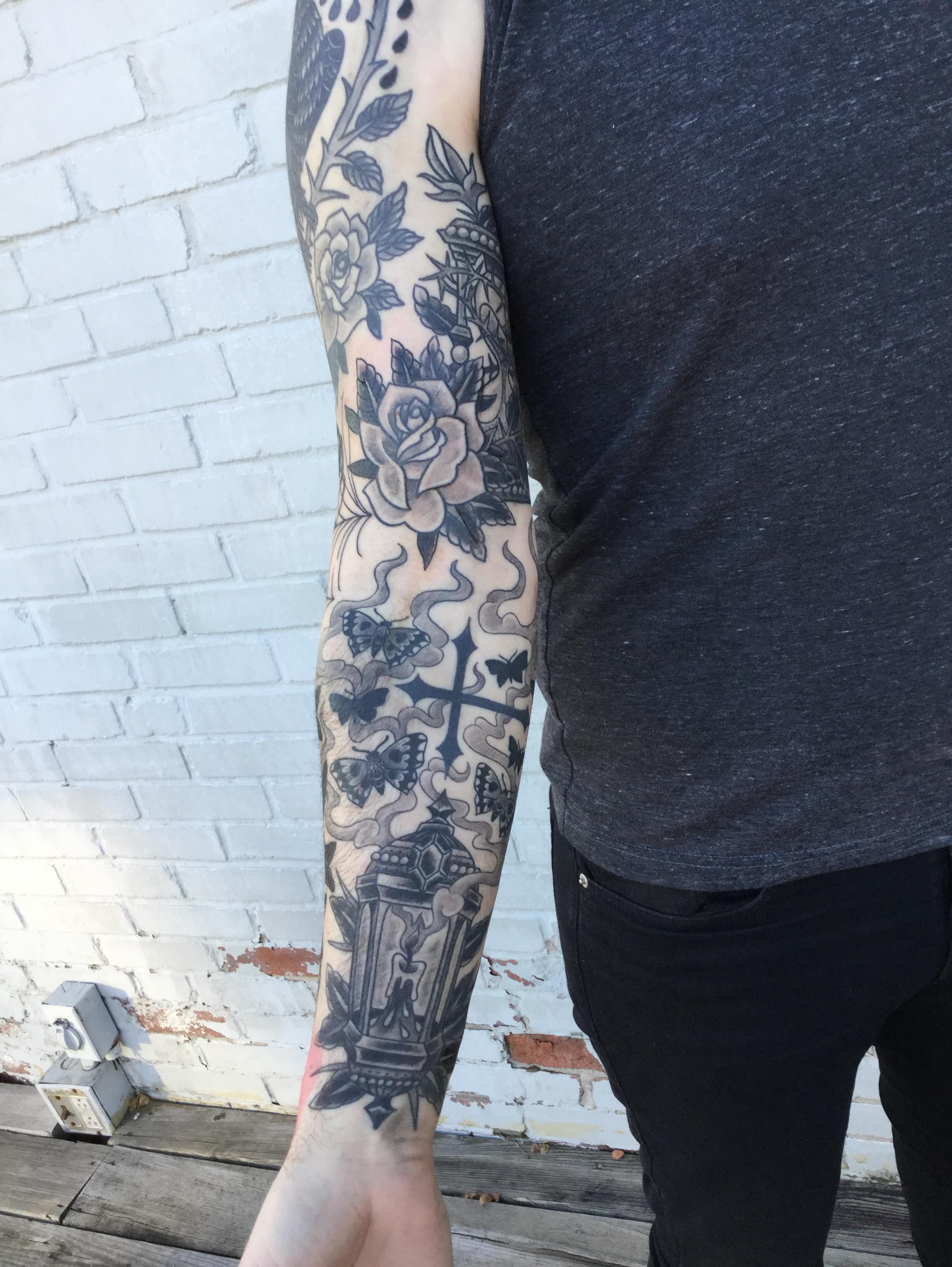 Roses and cross American traditional tattoo on the forearm by Ravi Chandra, Mount Shasta, California