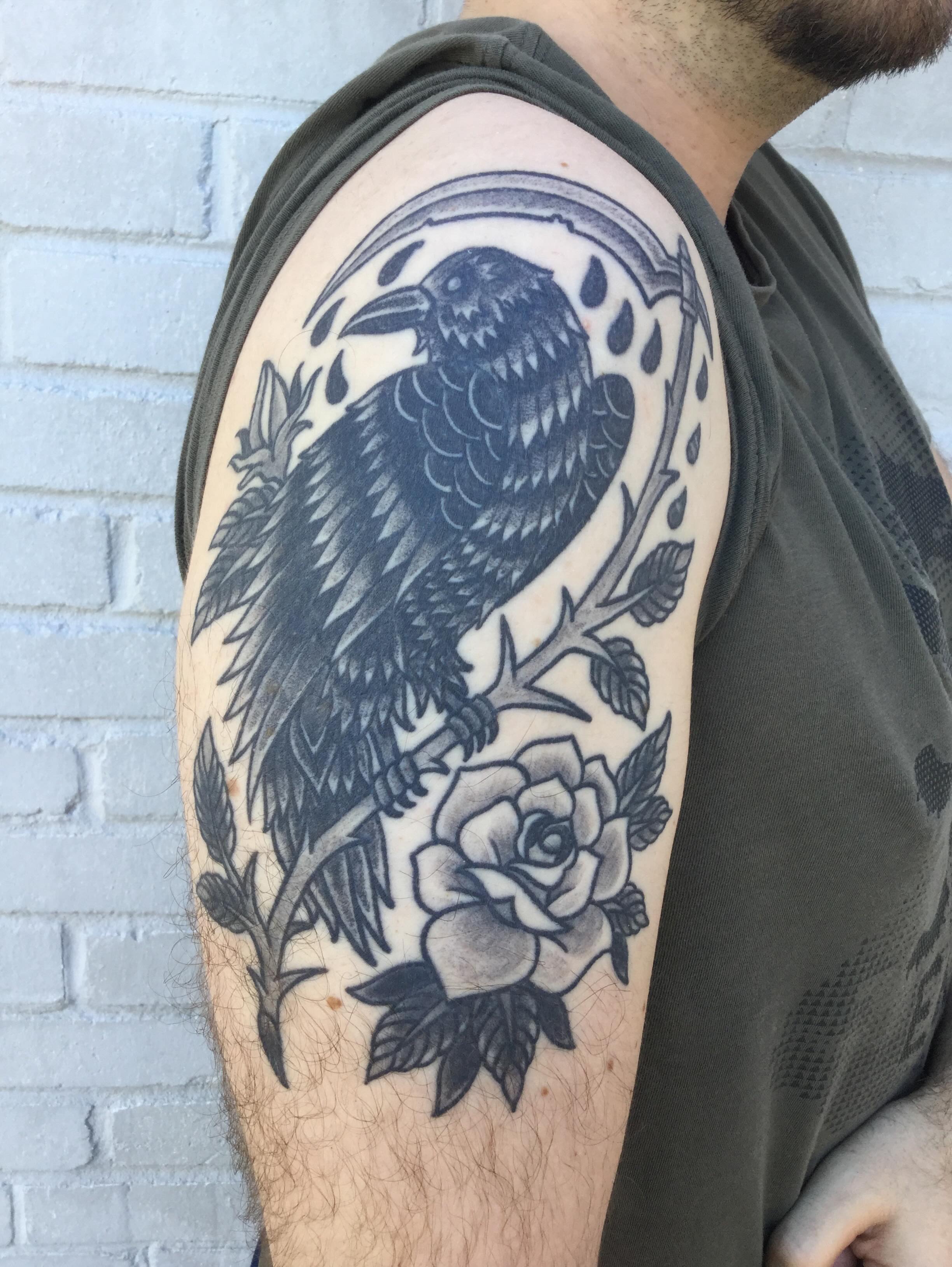 Crow and rose black and grey tattoo on the shoulder by Ravi Chandra, Mount Shasta, California