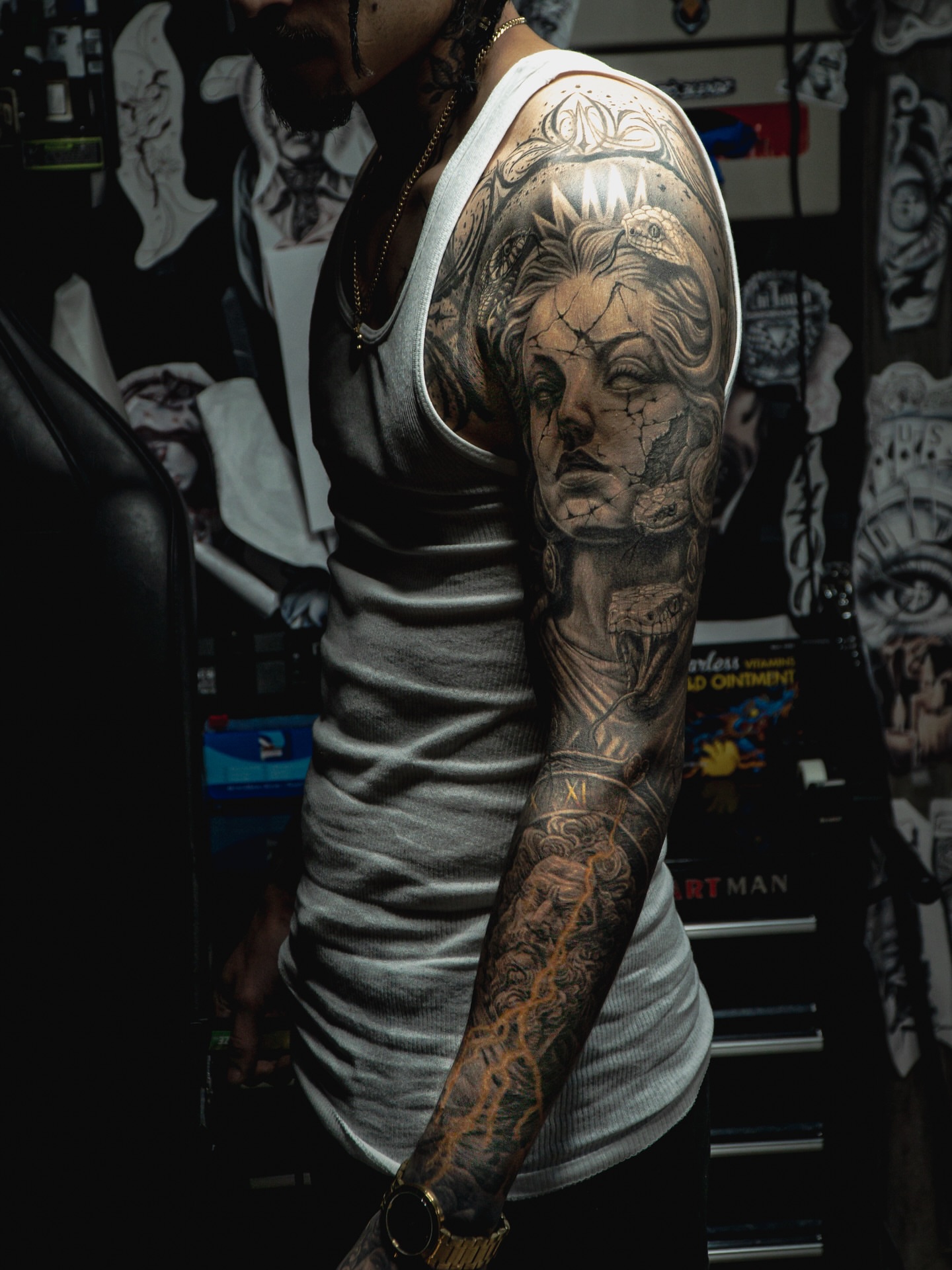 Woman's face realism tattoo on the upper arm by Omar Sheriff Herrera