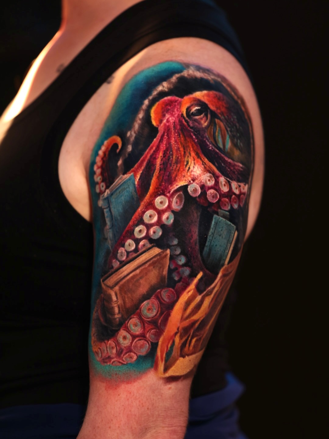 Octopus realism tattoo on the upper arm by Brandon Sontag