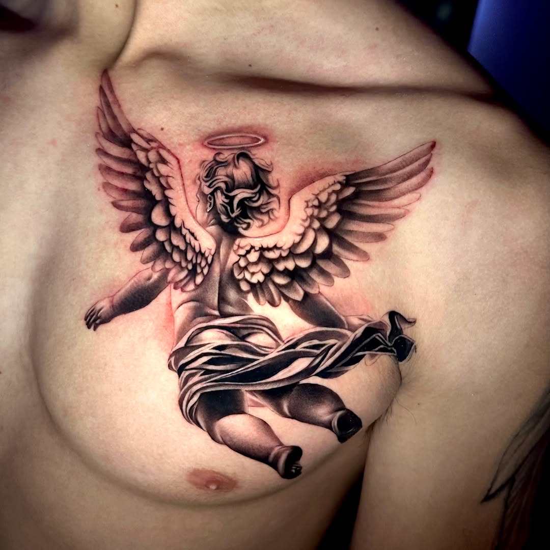 Cherub angel realism tattoo on the chest by Emma Sferdian🇷🇴