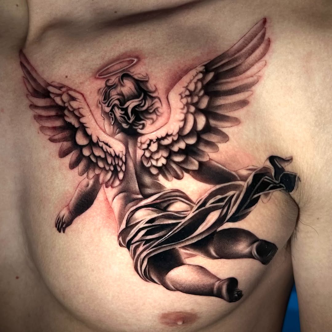 Cherub with drapery realism tattoo on the chest by Emma Sferdian🇷🇴