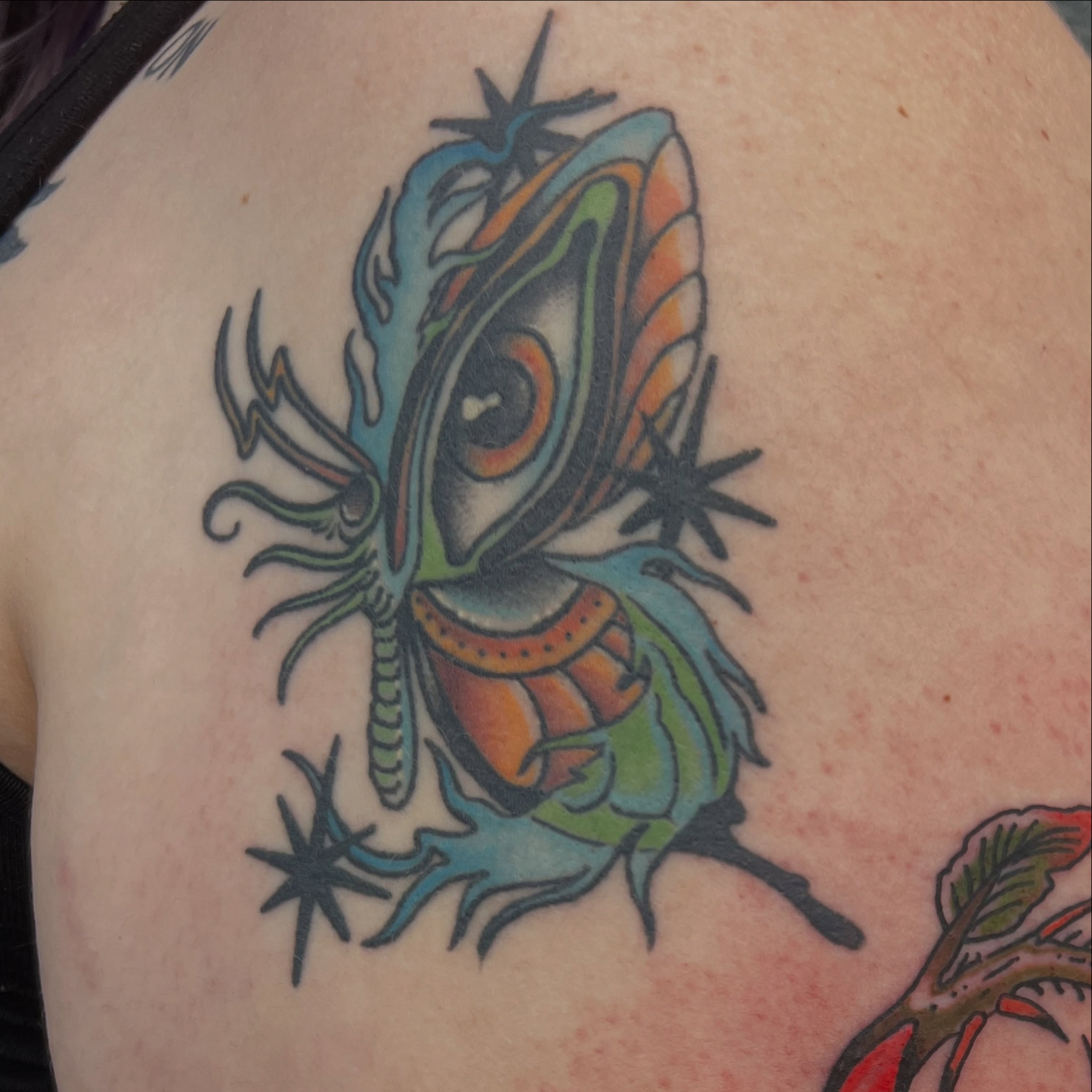 Alien American traditional tattoo on the chest by Andrea Patterson