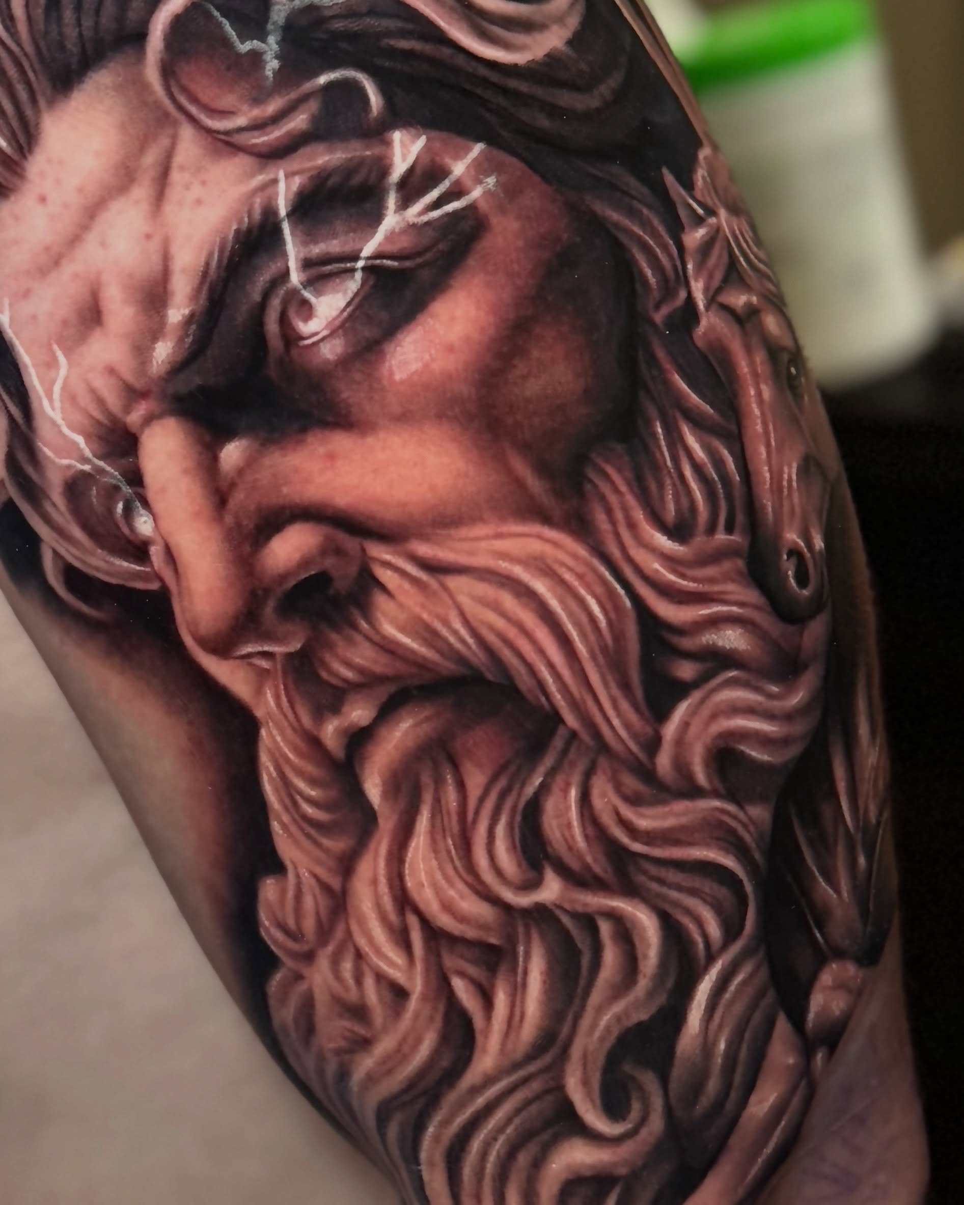 God-like figure realism tattoo on the forearm by Sebastian Calderon