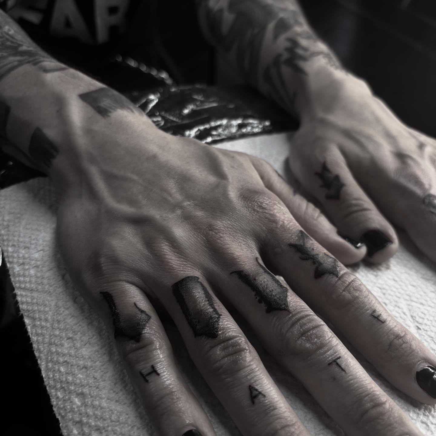Finger tattoos black and grey tattoo on the hand by suzie