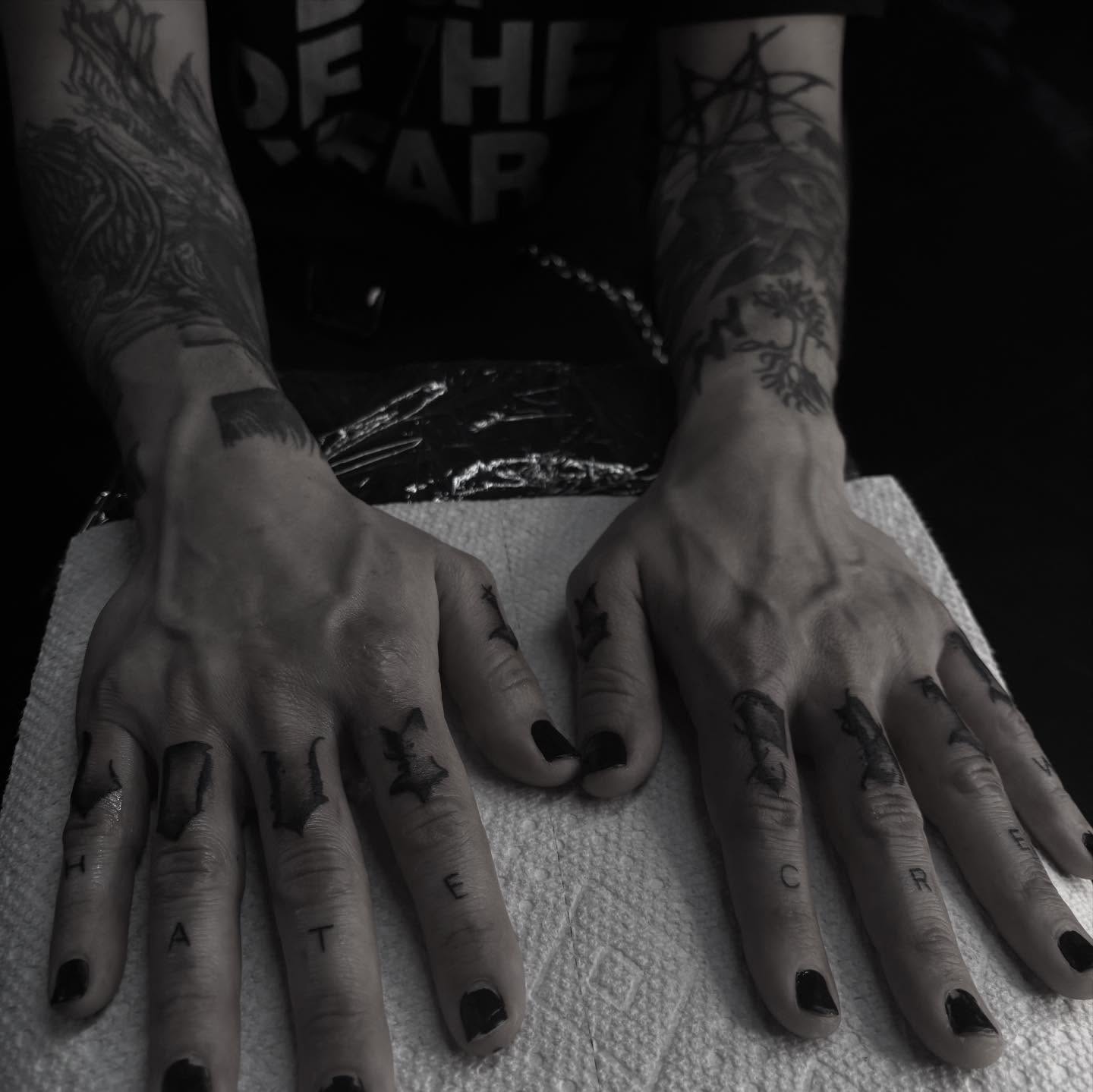 Finger tattoos black and grey tattoo on the hand by suzie