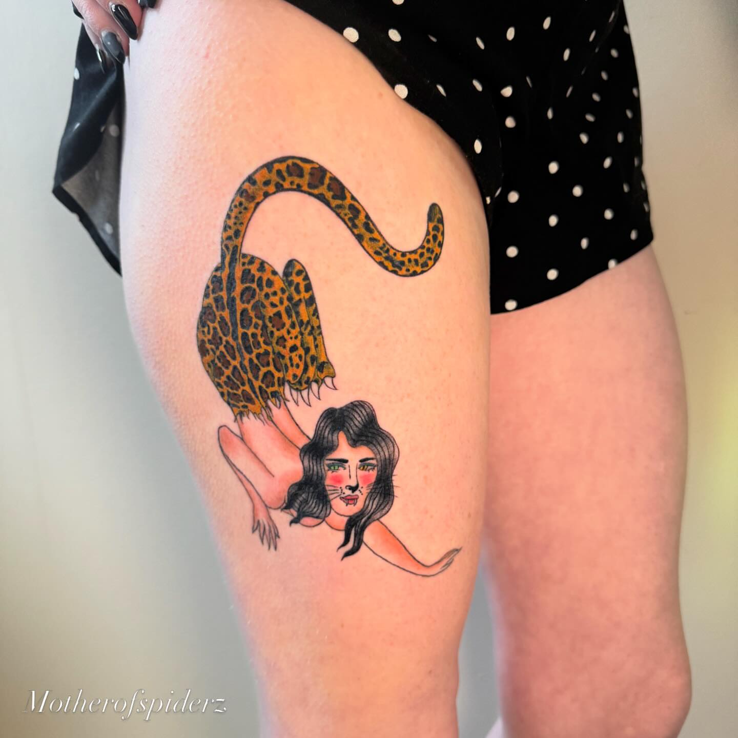 Woman with leopard tail illustrative tattoo on the thigh by Alyssa Garza