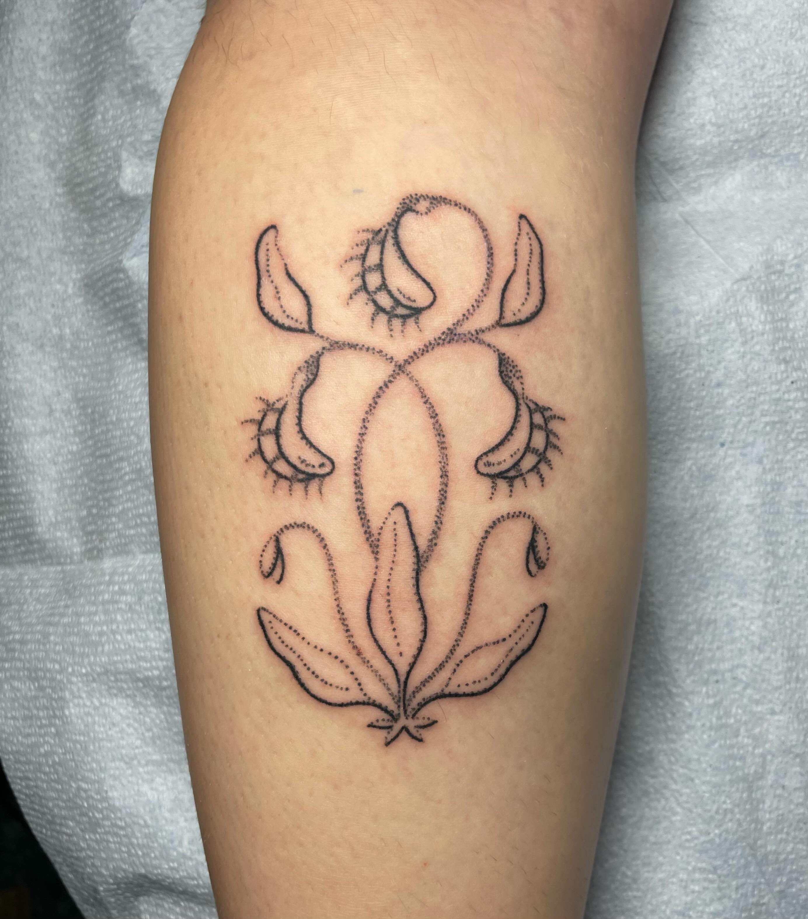 Lotus flower dotwork tattoo on the forearm by Quin