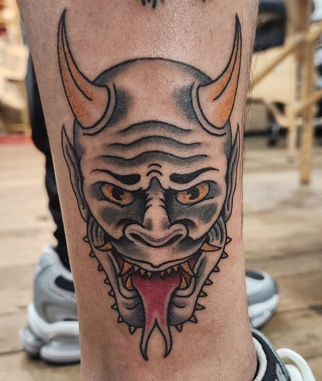 Oni mask neo-traditional tattoo on the forearm by Douglas Grady
