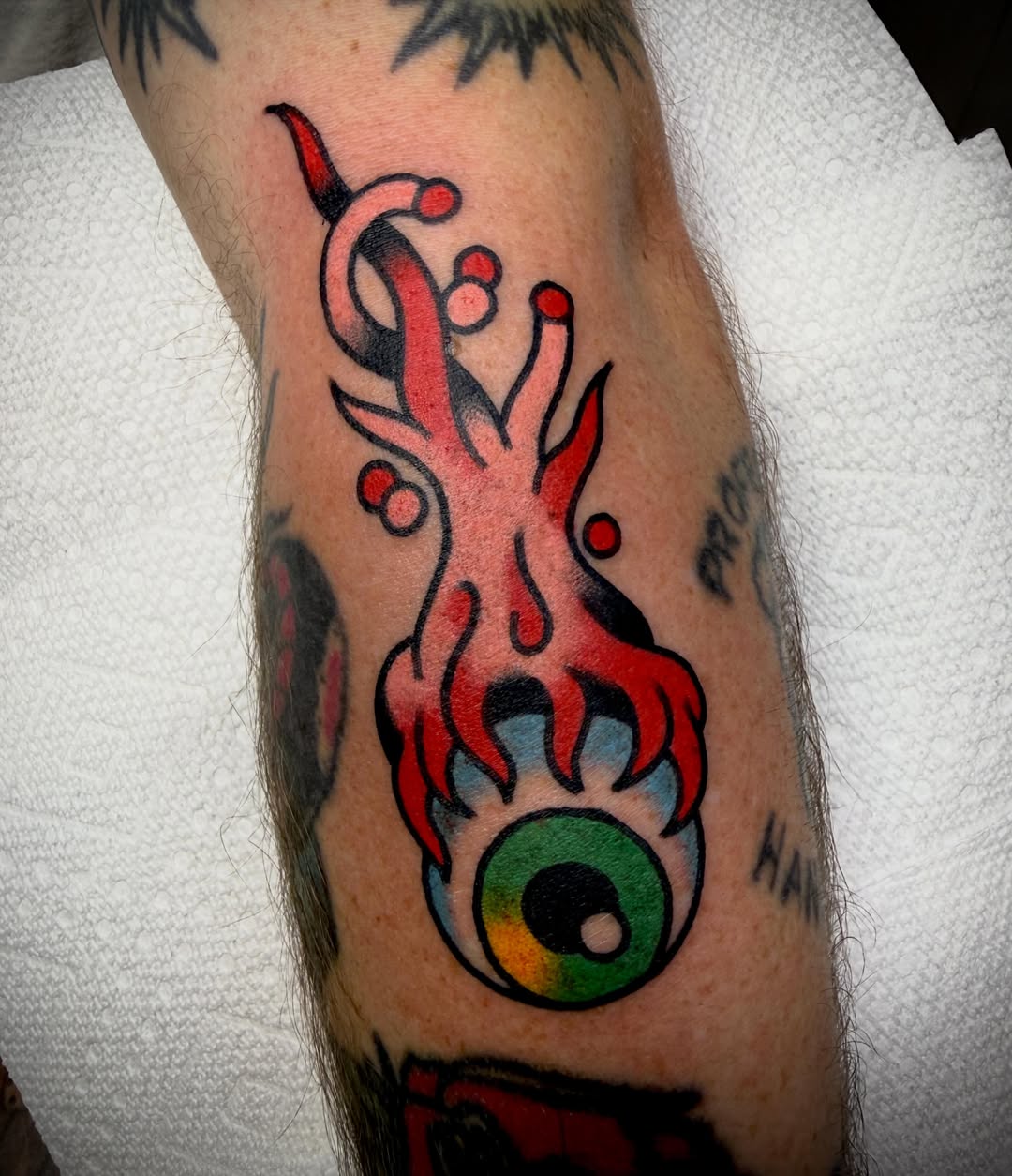 Eye with flame American traditional tattoo on the forearm by Tristan Bradshaw