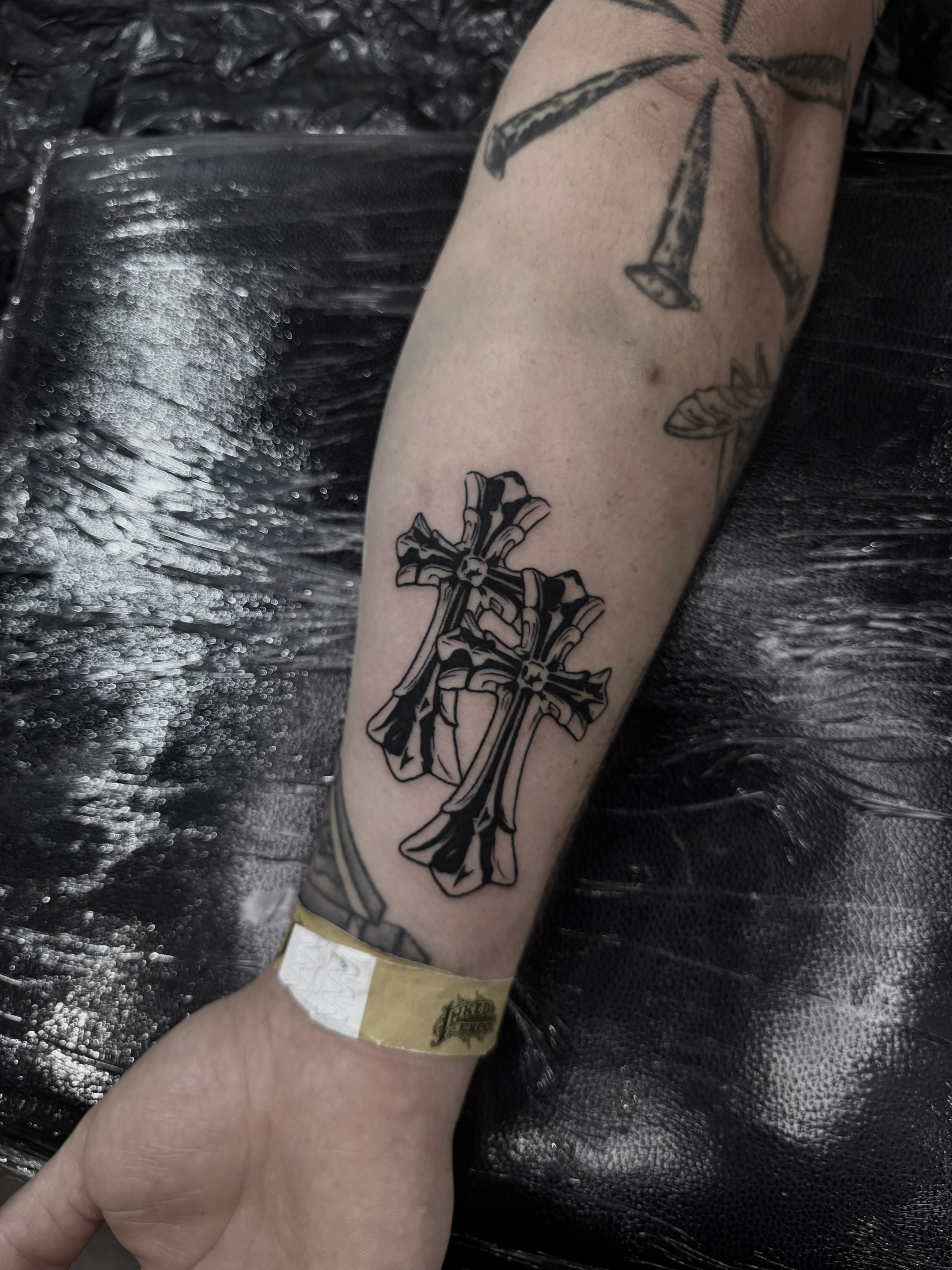 Cross black and grey tattoo on the forearm by Blackwork Vamos