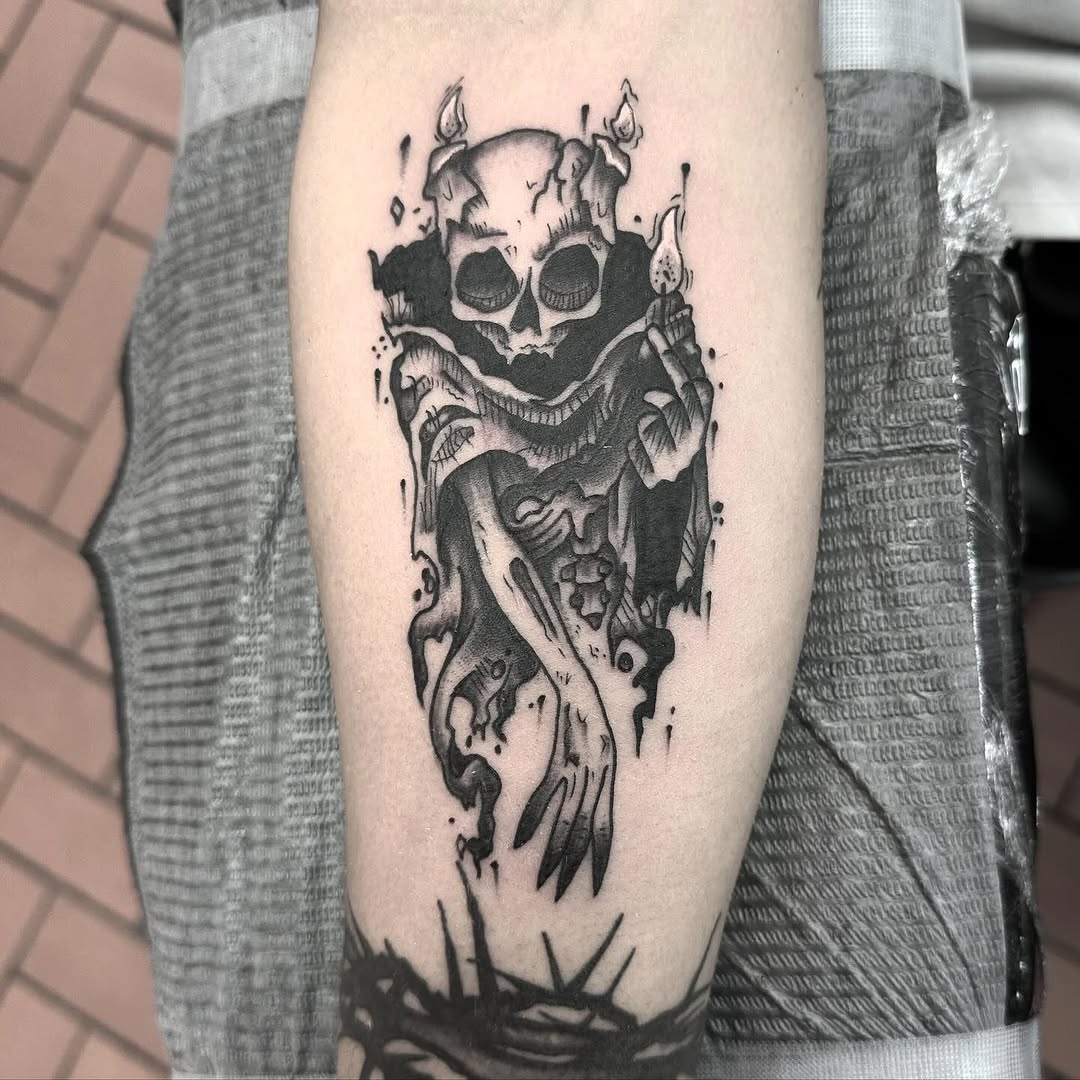 Skull with candles dark art tattoo on the forearm by Rafael Lubowitz