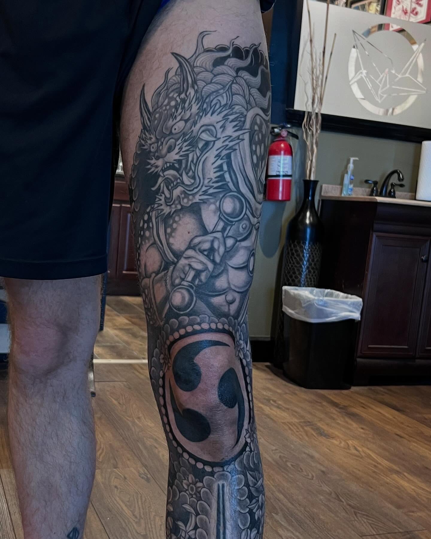 Dragon and yin-yang realism tattoo on the forearm by Jesse Gray