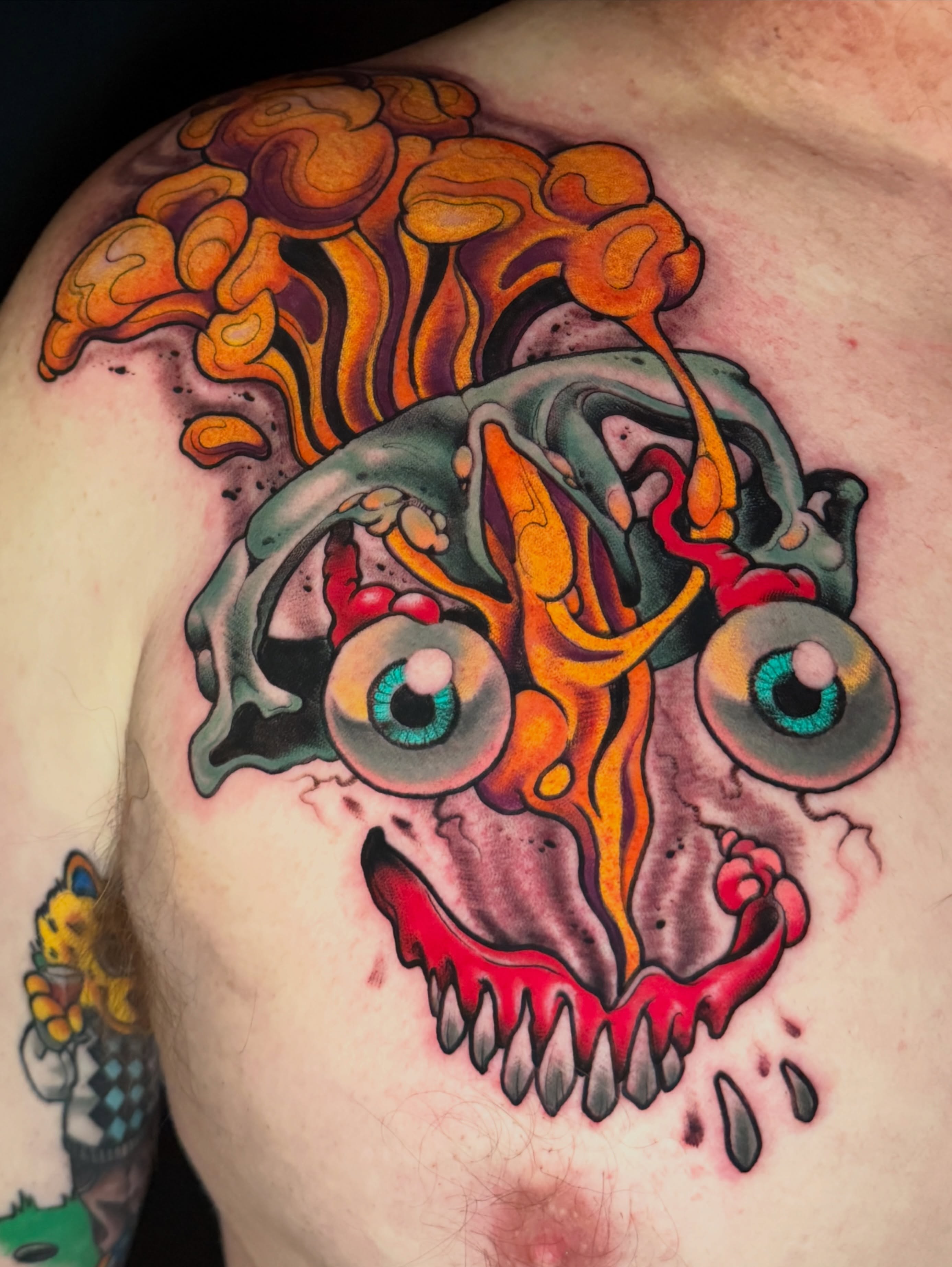 Psychedelic clown face new school tattoo on the shoulder by JoshUA Bowers, Des Moines, Iowa